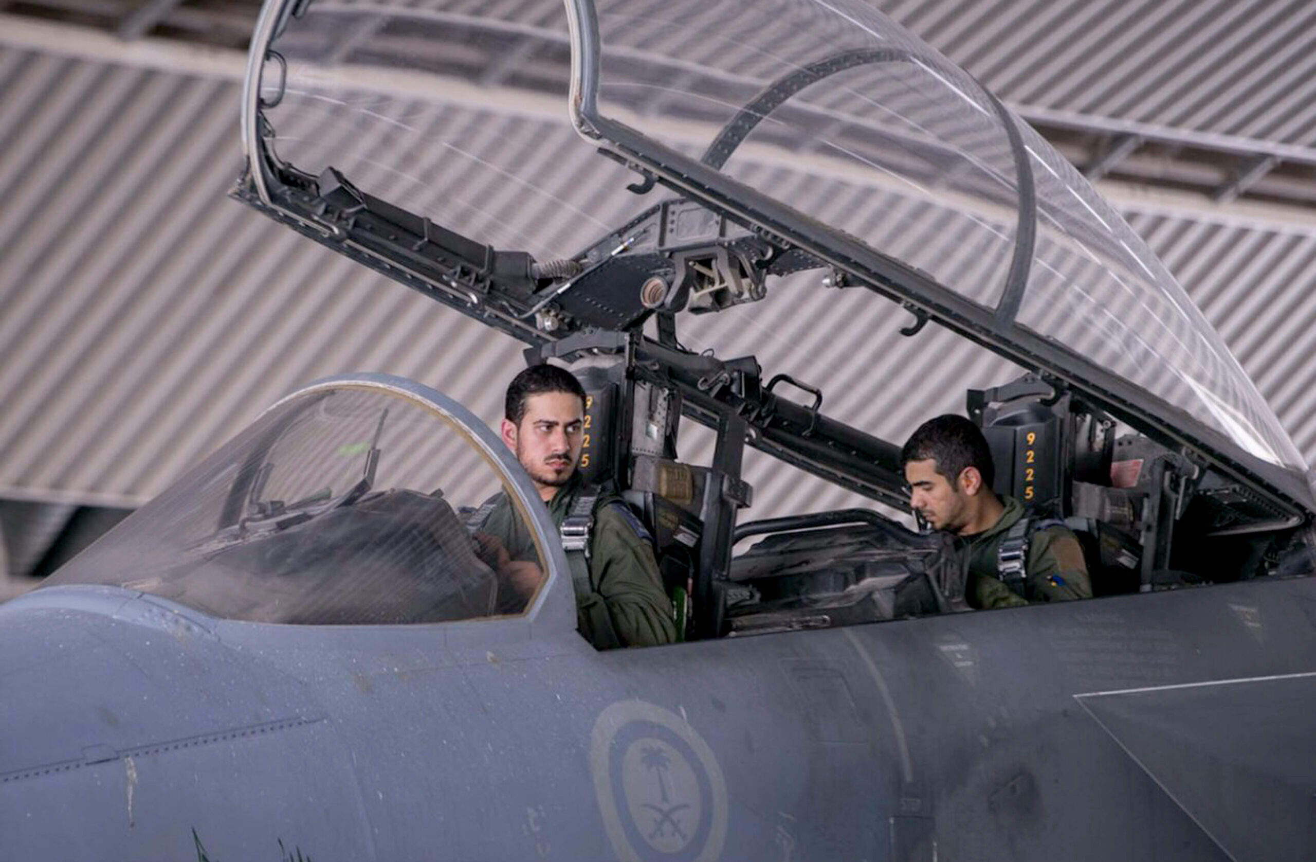 Saudi pilots sits in the cockpit of a fighter jet as part of U.S.-led coalition airstrikes on the Islamic State in Iraq and the Levant and other targets in Syria, in Saudi Arabia, Sept. 24, 2014. (AP Photo/Saudi Press Agency)