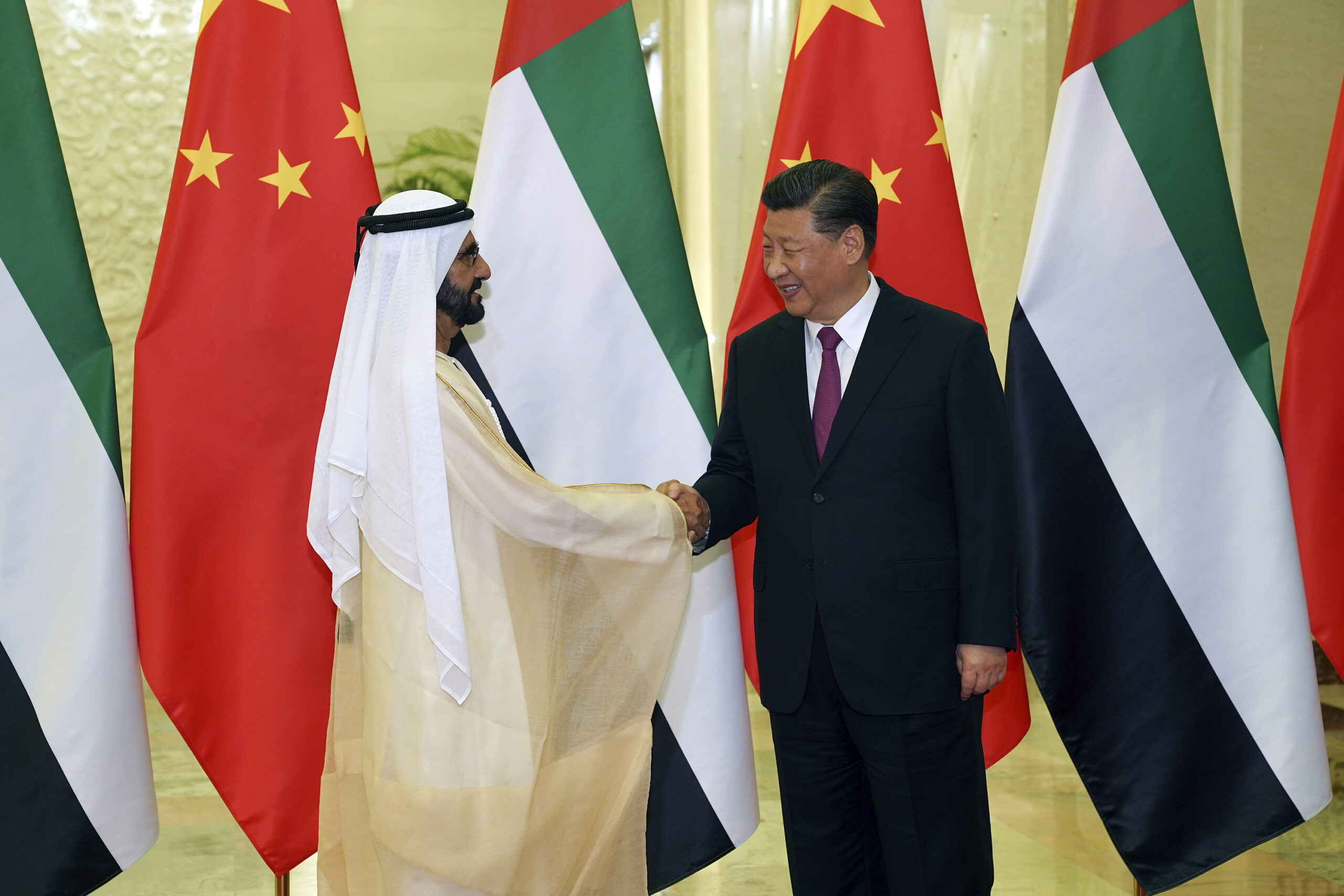 Chinese President Xi Jinping, right, shakes hands with Mohammed bin Rashid al-Maktoum, UAE vice president and prime minister, and ruler of Dubai, before a bilateral meeting of the Second Belt and Road Forum in Beijing, China, April 25. (Andrea Verdelli via AP)