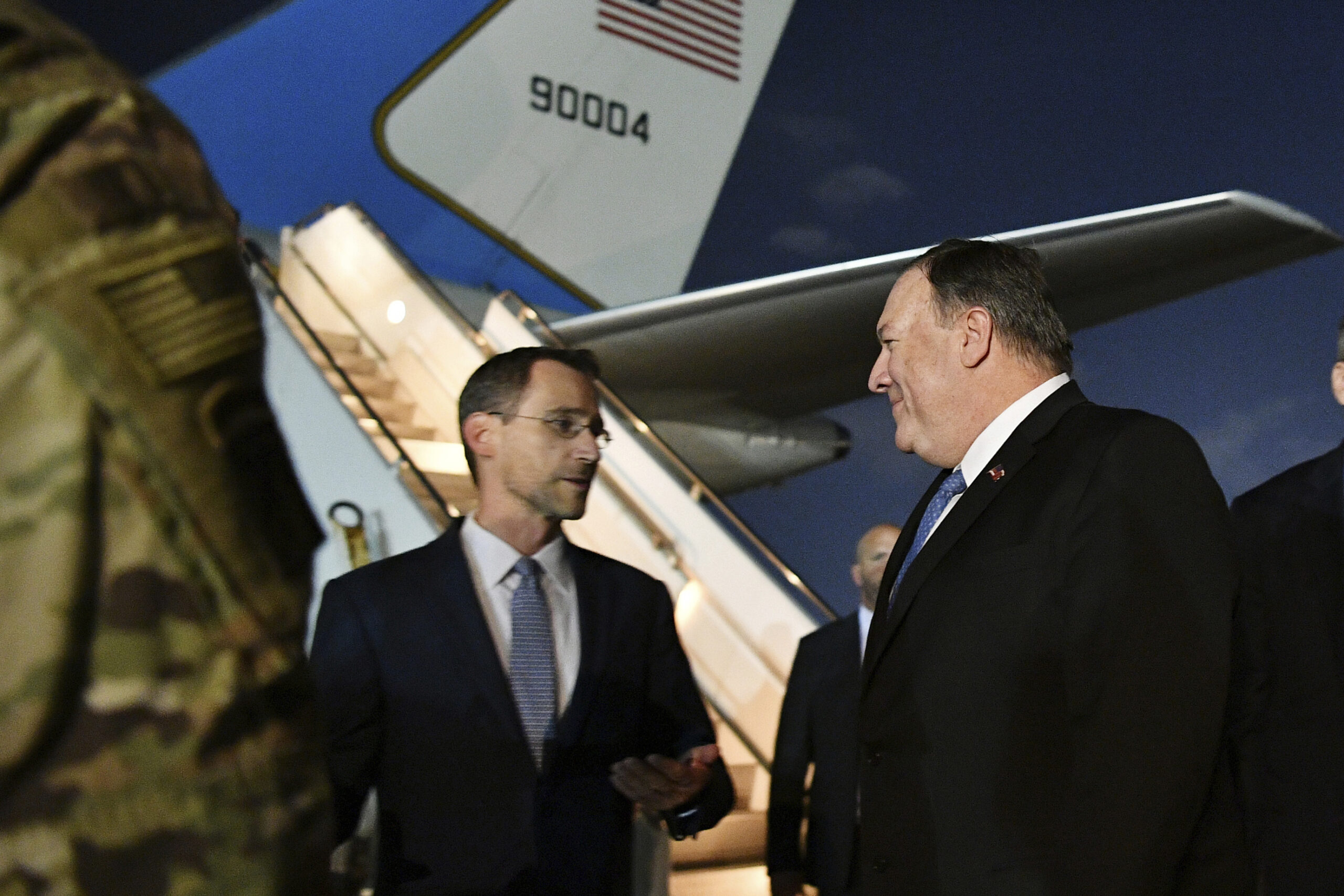 U.S Secretary of State Mike Pompeo, center, talks with Joey Hood, left, chargé d'affaires at the U.S. Embassy in Baghdad, after he arrived in Baghdad, Iraq, May 7. (Mandel Ngan via AP)