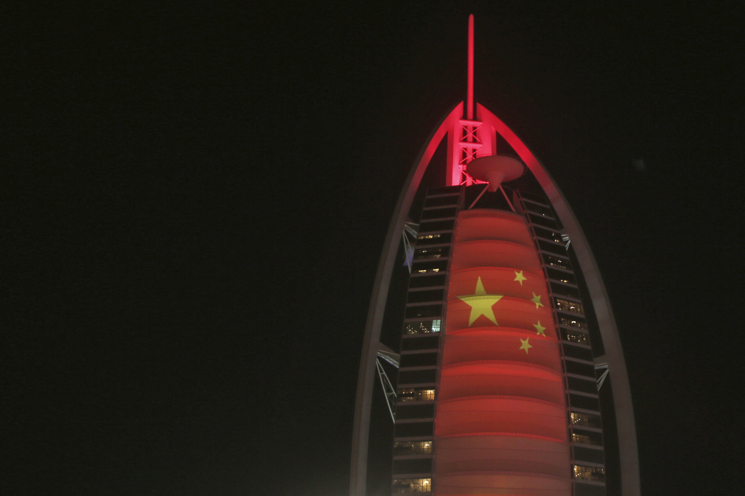 The Chinese flag is projected onto the Burj Al Arab hotel to celebrate the UAE Chinese Week in Dubai, United Arab Emirates, July 18, 2018. (AP Photo/Kamran Jebreili)