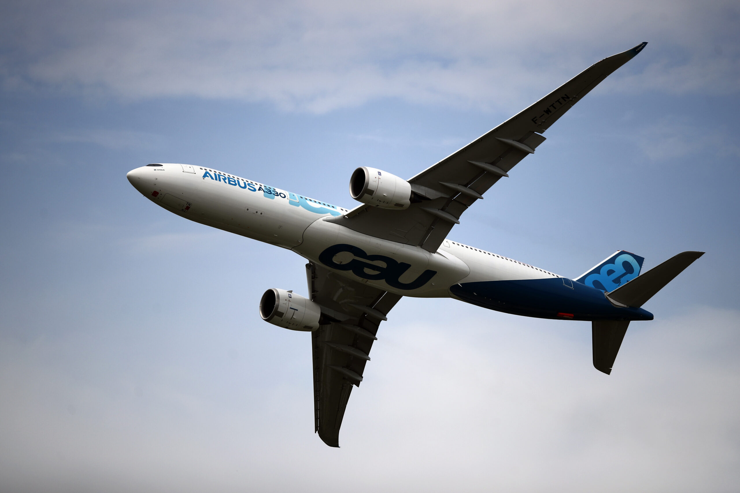 An Airbus A350 performs a demonstration flight at Paris Air Show, in Le Bourget, France, June 18. (AP Photo/ Francois Mori)