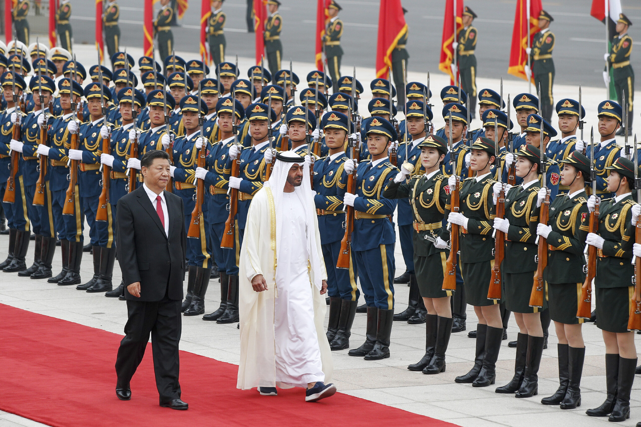 Abu Dhabi’s Crown Prince Mohammed bin Zayed al-Nahyan, right, and Chinese President Xi Jinping review an honor guard during a welcome ceremony in Beijing, July 22. (AP Photo/Andy Wong)