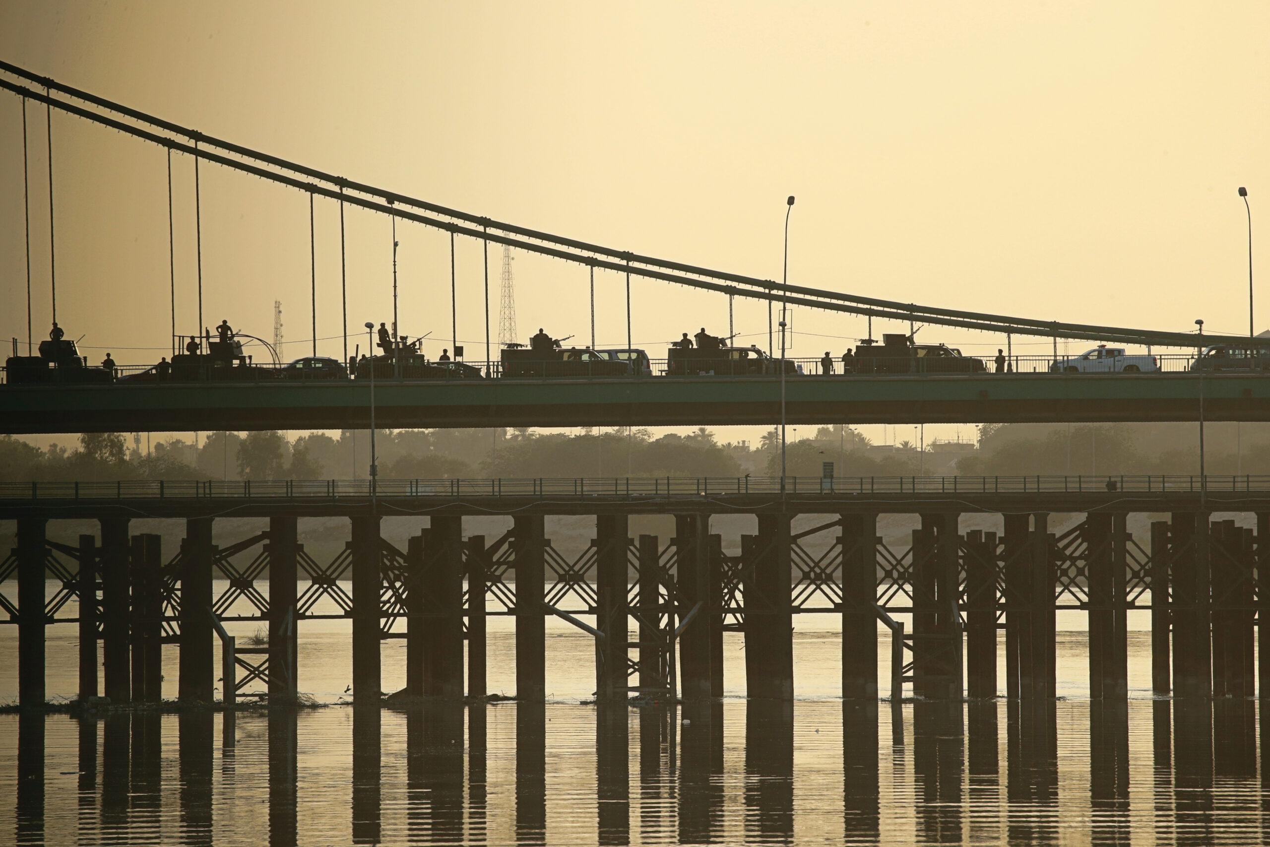 Popular Mobilization Forces close a bridge while surrounding the heavily fortified Green Zone in Baghdad, Iraq, May 26, 2021. (AP Photo/Hadi Mizban)