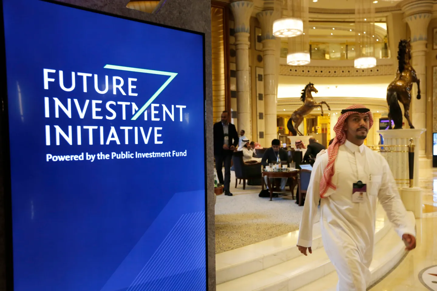 A participant at the Future Investment Initiative walks in the Ritz Carlton Hotel a day before the event, in Riyadh, Saudi Arabia, Oct. 28, 2019. (AP Photo/Amr Nabil)