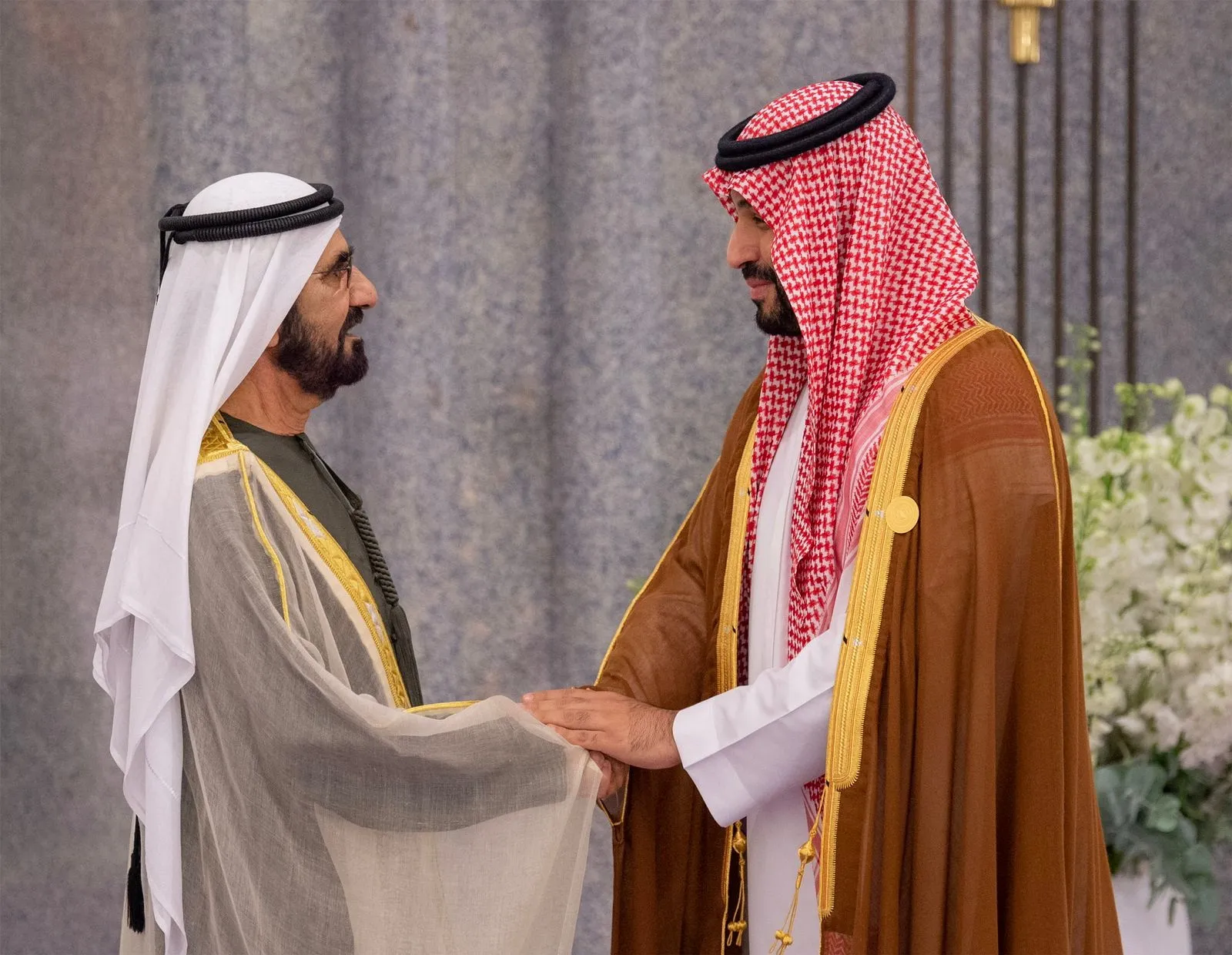 Saudi Arabia’s crown prince, Mohammed bin Salman, welcomes the vice president of the United Arab Emirates and ruler of Dubai, Mohammed bin Rashid al-Maktoum, during the 18th consultative meeting of the leaders of the Gulf Cooperation Council and the GCC-Central Asia summit, in Jeddah, Saudi Arabia, July 19. (Saudi Press Agency/Handout via REUTERS)