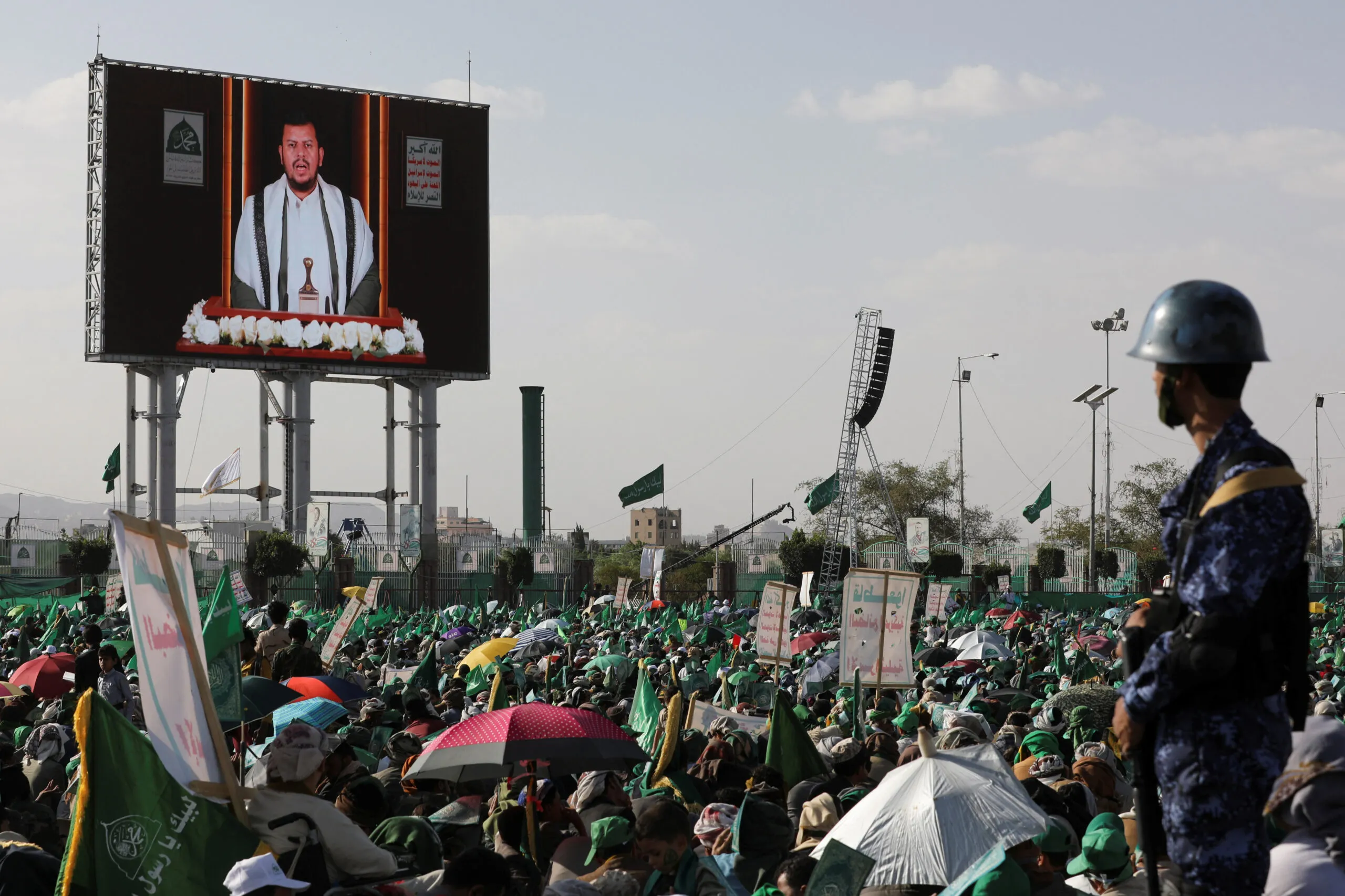 Houthi leader Abdul Malik al-Houthi delivers a speech through a TV screen during a rally to mark the birthday of the Prophet Muhammad, in Sanaa, Yemen, September 27. (REUTERS/Khaled Abdullah)