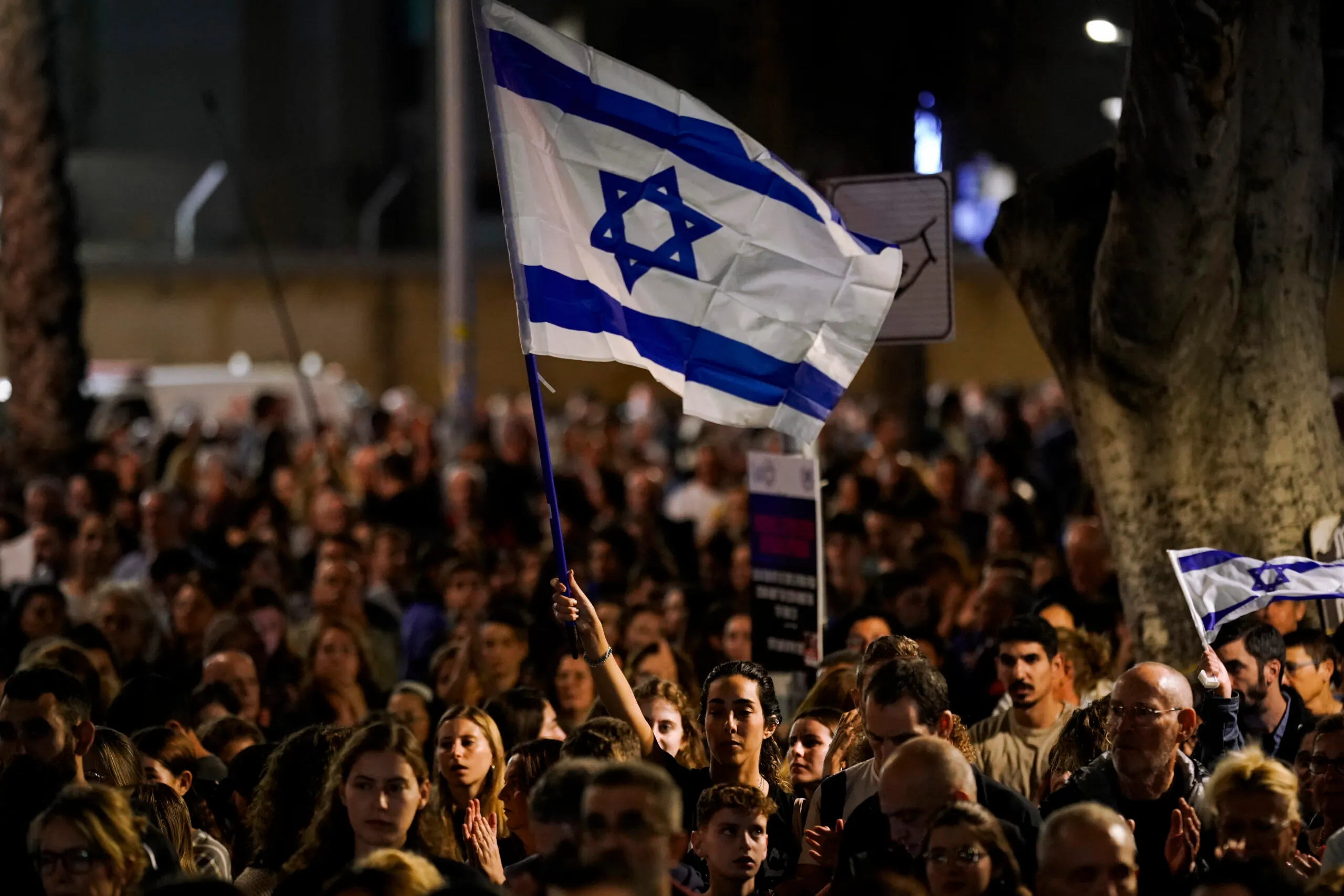 People participate in a show of solidarity with hostages being held in the Gaza Strip, near the Museum of Art in Tel Aviv, Israel, Saturday, Nov. 25, 2023. (AP Photo/ Leo Correa)