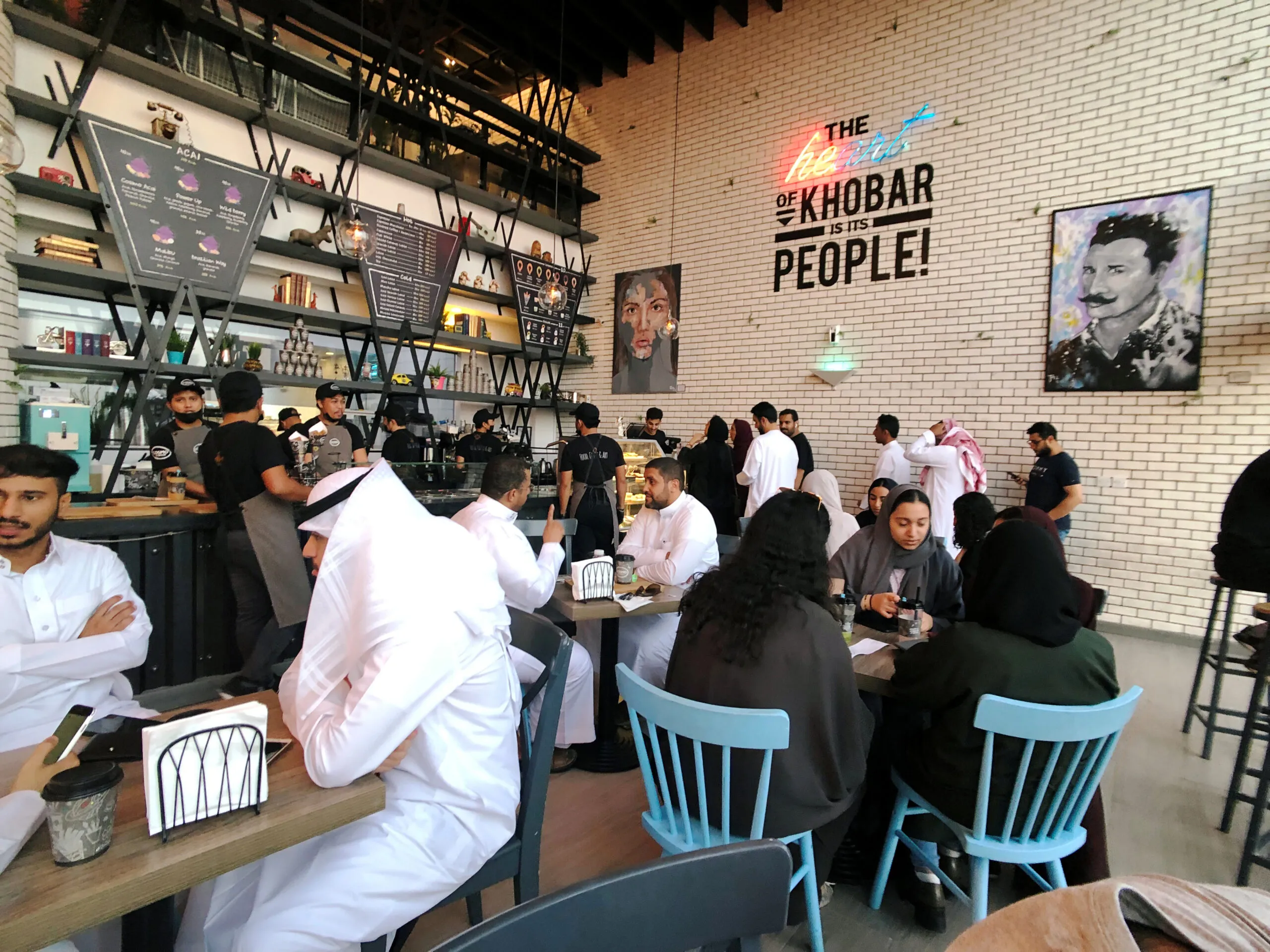 Women sit among men in a newly opened cafe in Khobar, Saudi Arabia, August 2, 2019. (REUTERS/ Hamad I Mohammed)