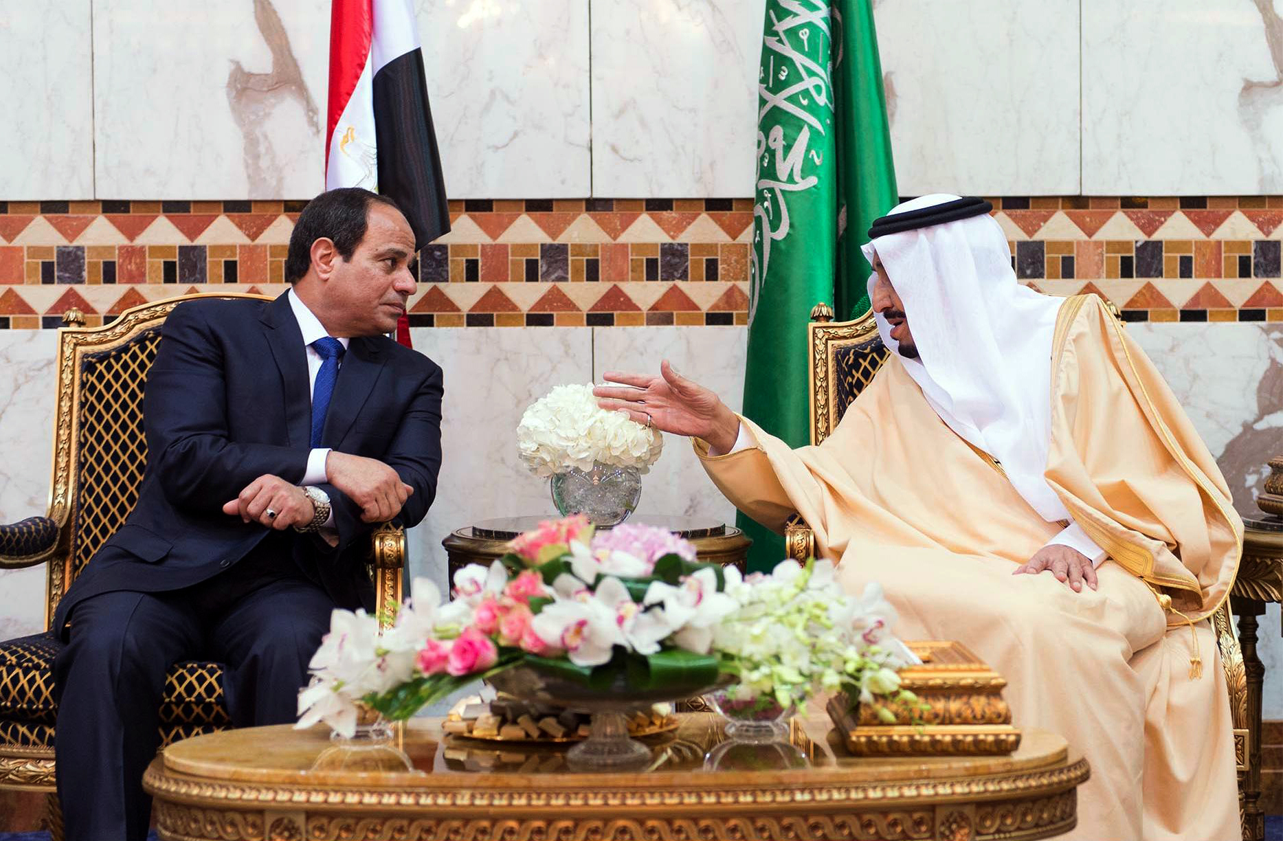 Saudi King Salman bin Abdulaziz, right, meets with Egyptian President Abdel Fattah al-Sisi upon his arrival to Riyadh Airbase, Riyadh, Saudi Arabia, March 1, 2015. (SPA via AP)