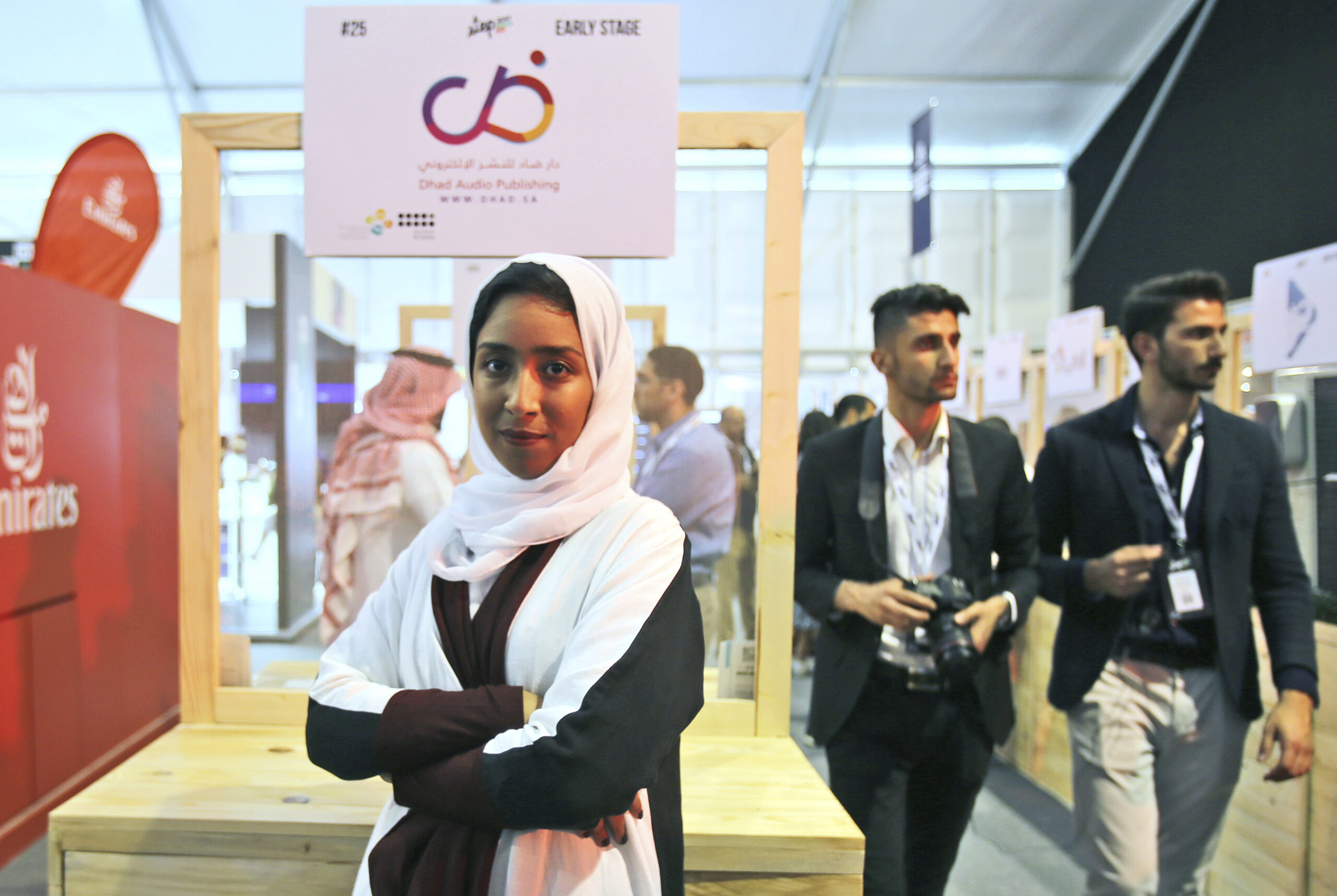 Saudi entrepreneur, Manar Alomayri, a partner of Dhad Audio Publishing, poses for the camera in front of her stand at the Digital Media Services tent as a part of the Step 2017 Conference and Music in Dubai, United Arab Emirates, April 5, 2017. (AP Photo/Kamran Jebreili)
