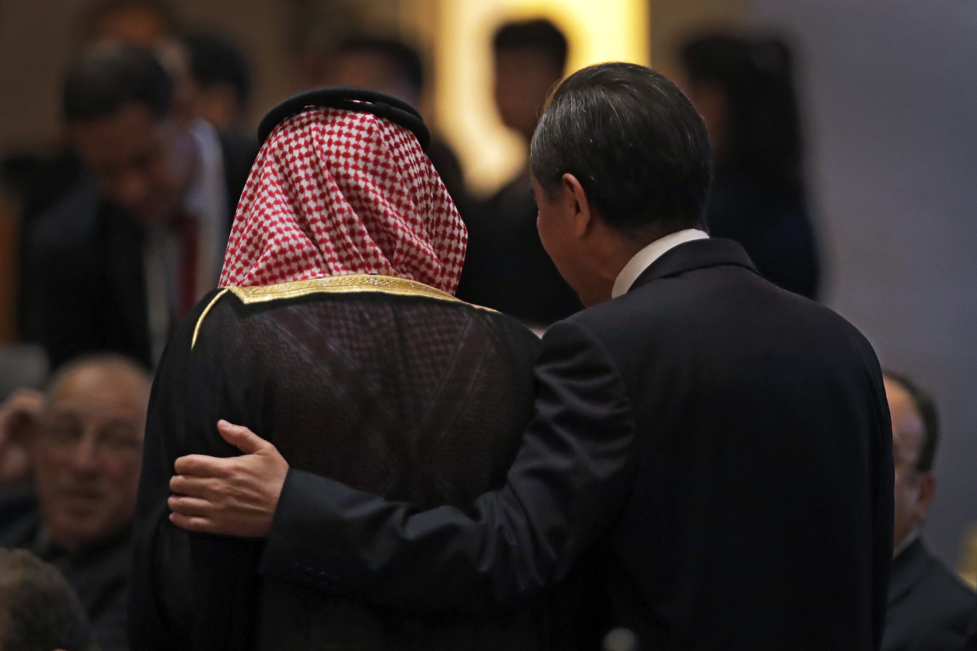 Chinese Foreign Minister Wang Yi, right, and Saudi Arabia's Foreign Minister Adel al-Jubeir arrive to at the 8th Ministerial Meeting of the China-Arab States Cooperation Forum at the Diaoyutai State Guesthouse in Beijing, July 10. (AP Photo/Andy Wong)