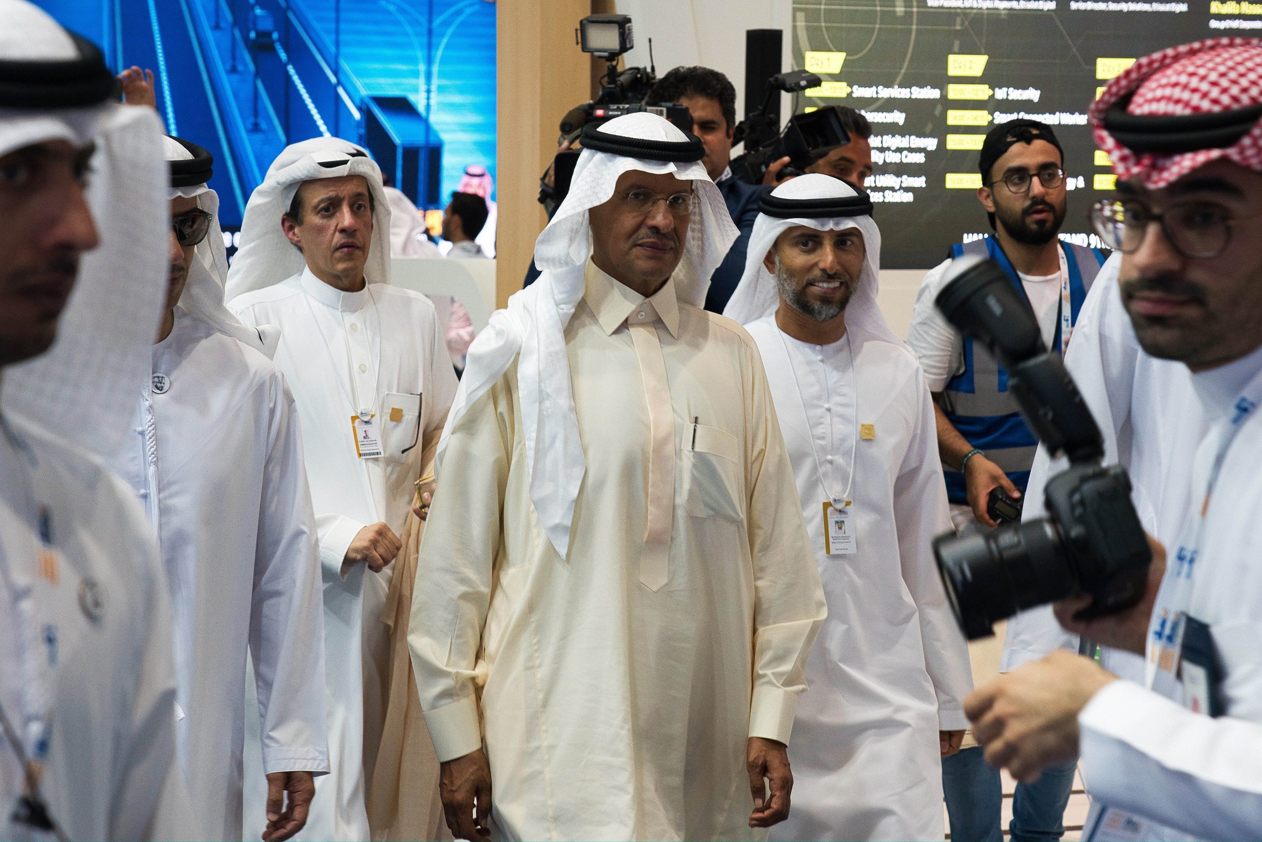 Saudi Energy Minister Prince Abdulaziz bin Salman, center, and Emirati Energy Minister Suhail Mohamed Faraj al-Mazrouei, right, walk through an energy exhibition in Abu Dhabi, United Arab Emirates, Sept. 9, 2019. (AP Photo/Jon Gambrell)