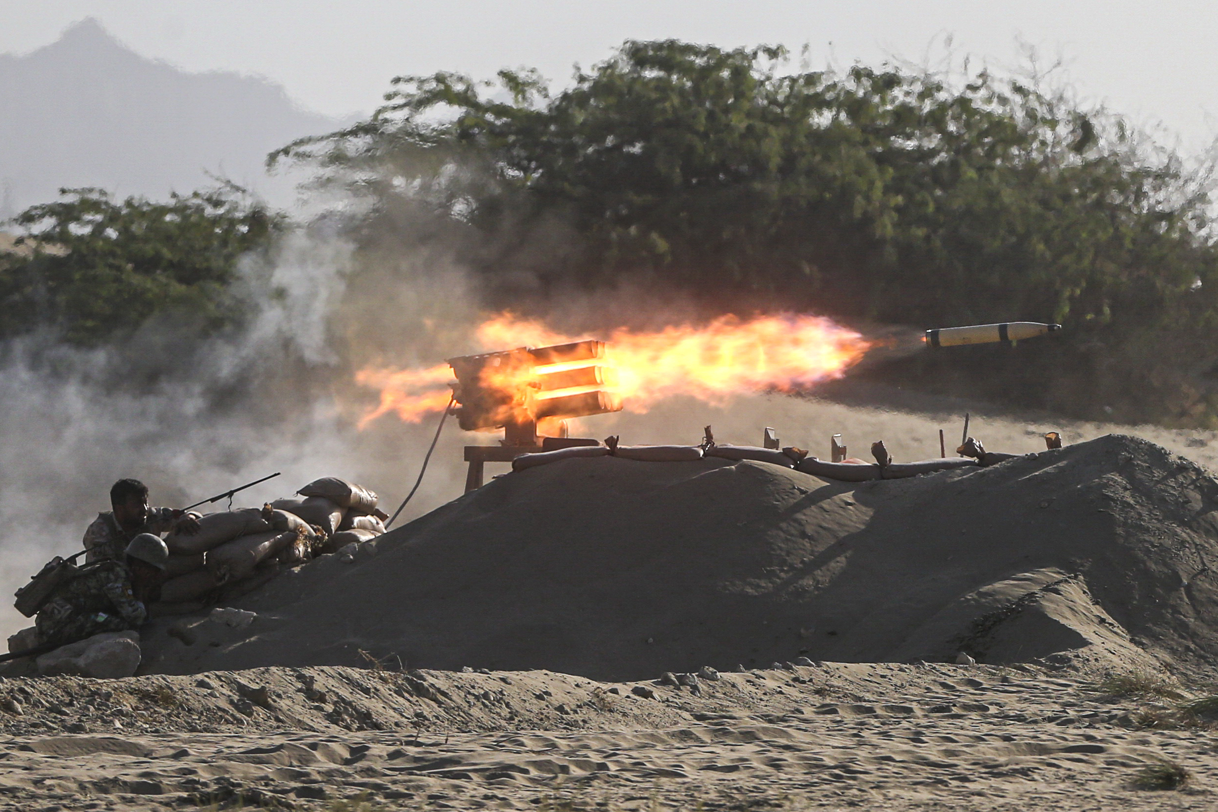 Iranian troops participate in a military drill near the Strait of Hormuz, Iran, Sept. 10. (Mehdi Marizad/Fars News Agency via AP)