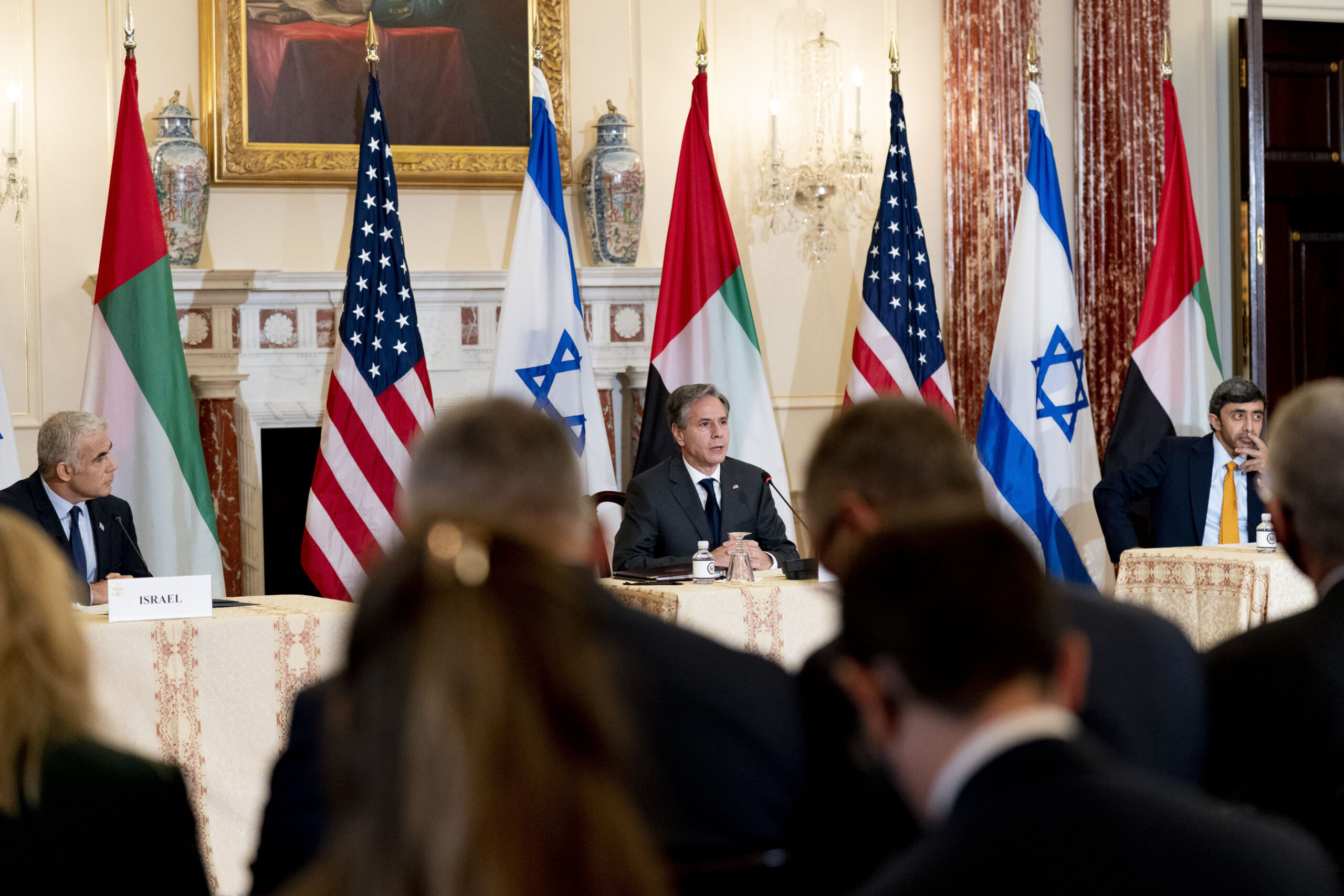 U.S. Secretary of State Antony Blinken, center, accompanied by Israeli Foreign Minister Yair Lapid, left, and UAE Foreign Minister Abdullah bin Zayed al-Nahyan, right, speaks at a joint news conference at the State Department in Washington, DC, Oct. 13, 2021. (AP Photo/Andrew Harnik)