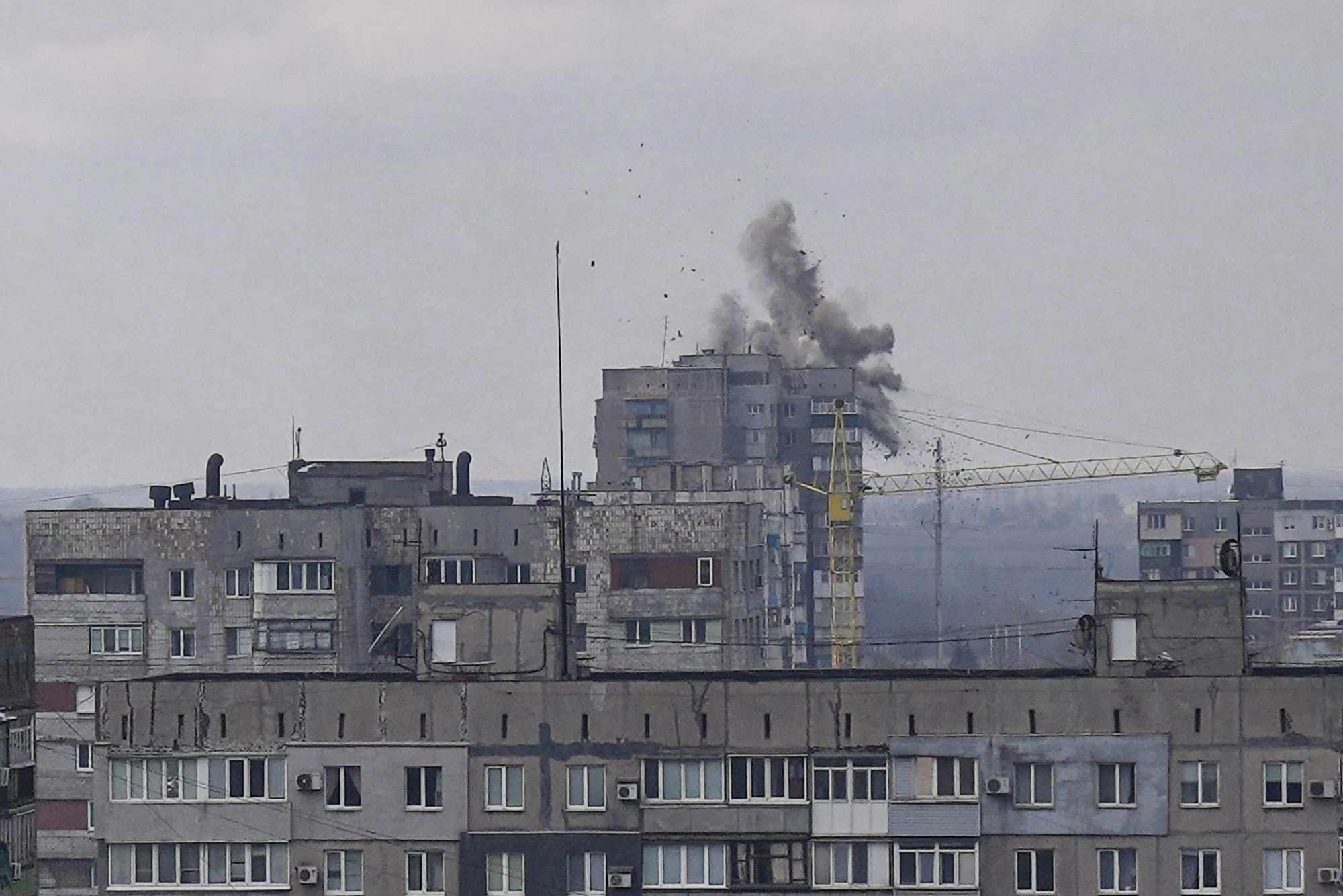 Explosions are seen during shelling in a residential district in Mariupol, Ukraine, March 10. (AP Photo/Evgeniy Maloletka)