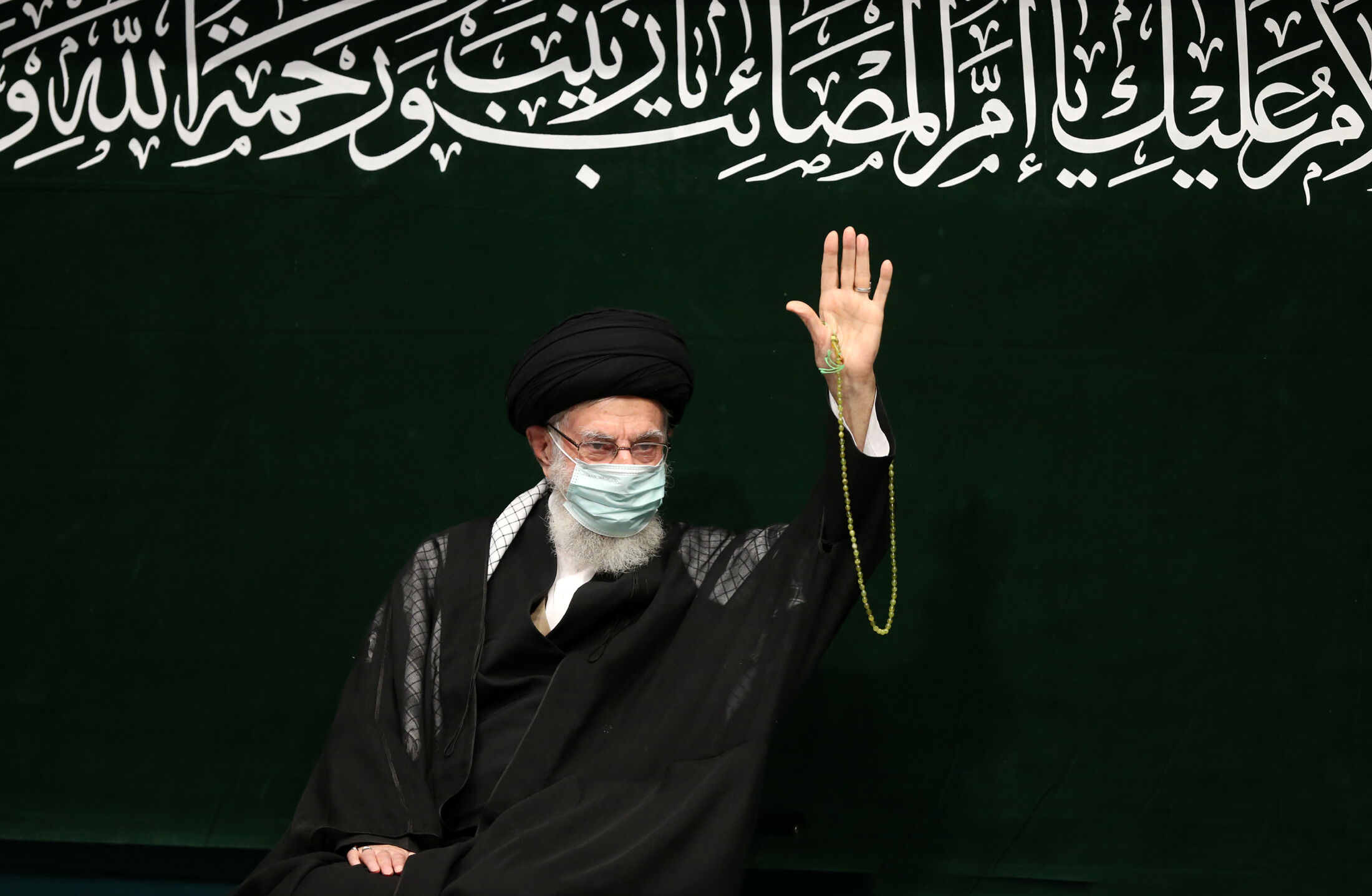 Iranian Supreme Leader Ayatollah Ali Khamenei waves to supporters during a religious ceremony, in Tehran, Iran, Sept. 17. (Office of the Iranian Supreme Leader via AP)
