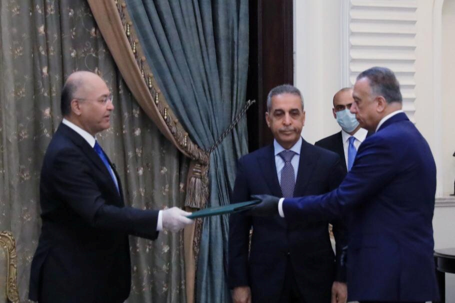 Iraq's President Barham Salih, left, with newly appointed Prime Minister-designate Mustafa al-Kadhimi, Baghdad, Iraq, April 9 (The Presidency of the Republic of Iraq Office/Handout via REUTERS)