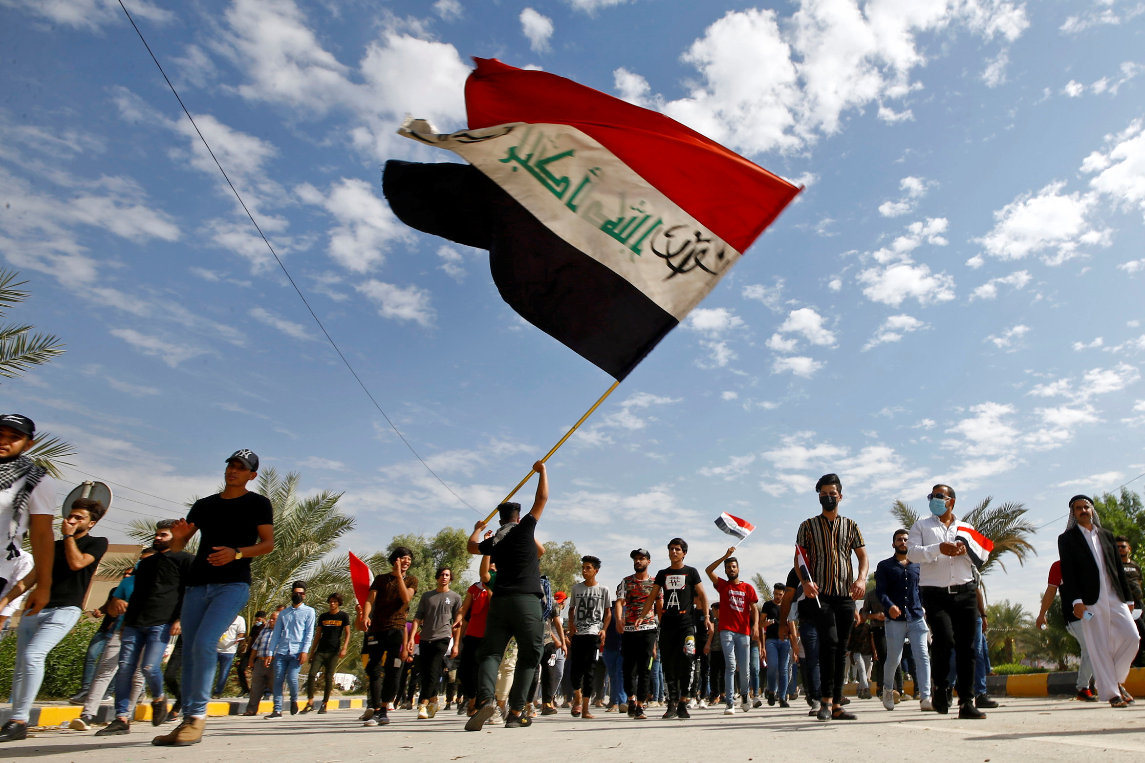 Iraqi demonstrators gather to mark the first anniversary of anti-government protests in Najaf, Iraq, October 25, 2020. (REUTERS/Alaa Al-Marjani)