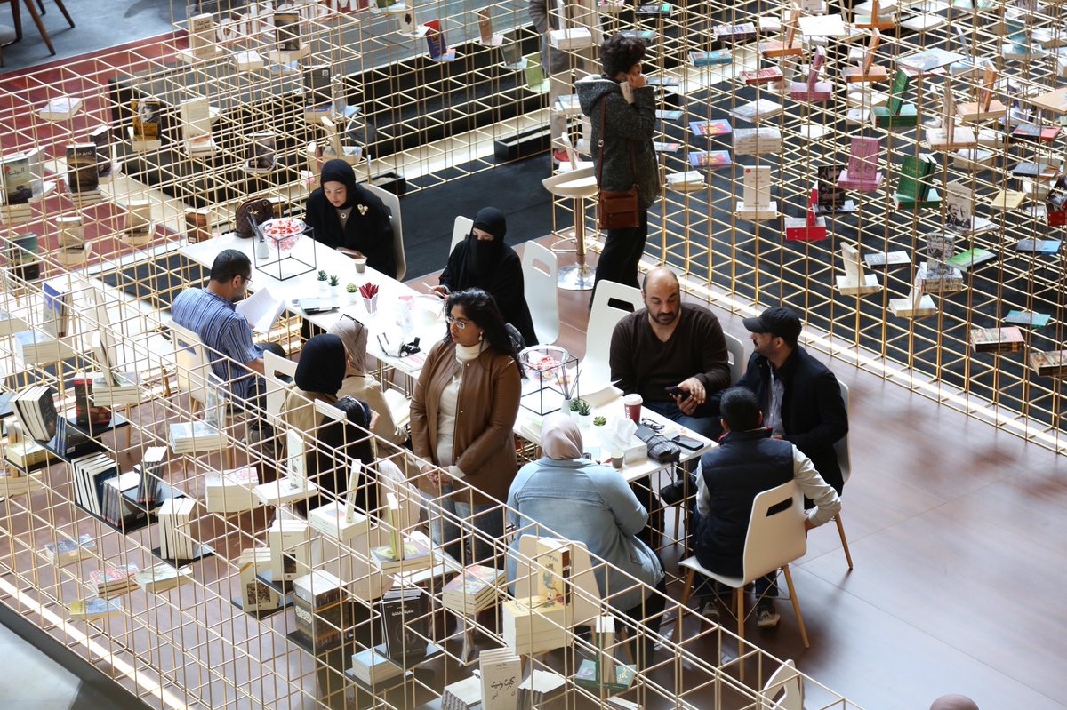 Readers gather for a charity reading marathon at Takween bookstore in 360 Mall, Kuwait.