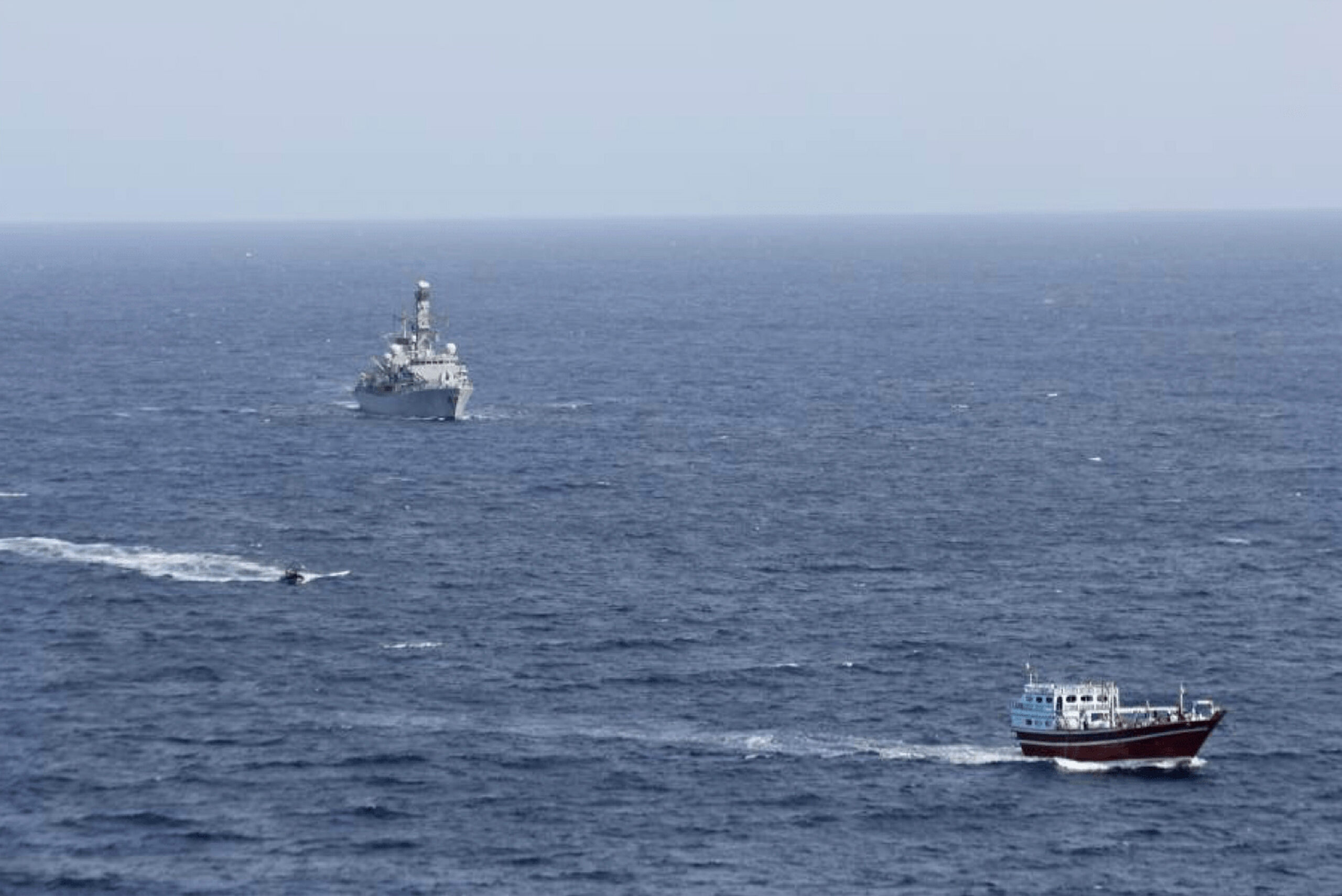 A British Royal Navy vessel transits toward a stateless boat in the northern Arabian Sea, October 14, 2020. (Combined Maritime Forces via AP)