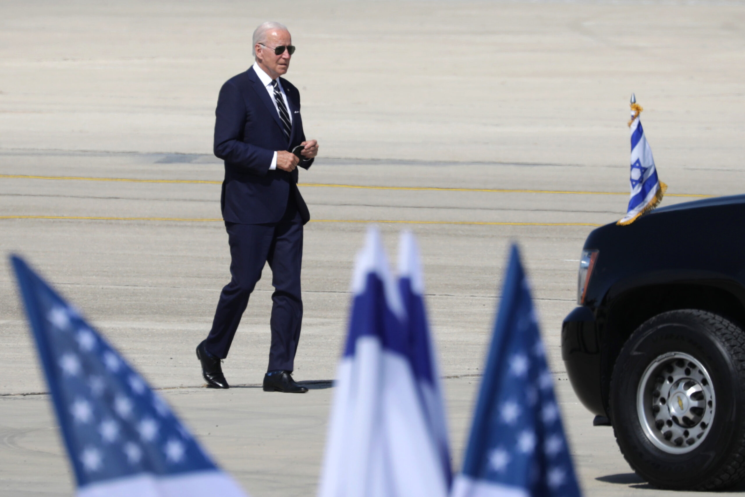 President Joseph R. Biden Jr. walks to Air Force One for his departure to Saudi Arabia from Ben Gurion Airport near Tel Aviv, Israel, July 15, 2022. (Abir Sultan/Pool Photo via AP)