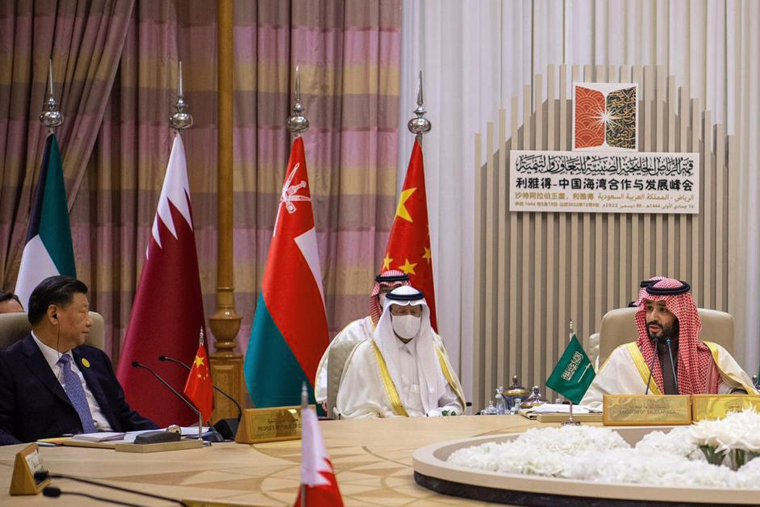 Saudi Crown Prince and Prime Minister Mohammed bin Salman, right, talks to Chinese President Xi Jinping, left, during the Gulf Cooperation Council summit in Riyadh, Saudi Arabia, December 9, 2022. (Saudi Press Agency via AP)