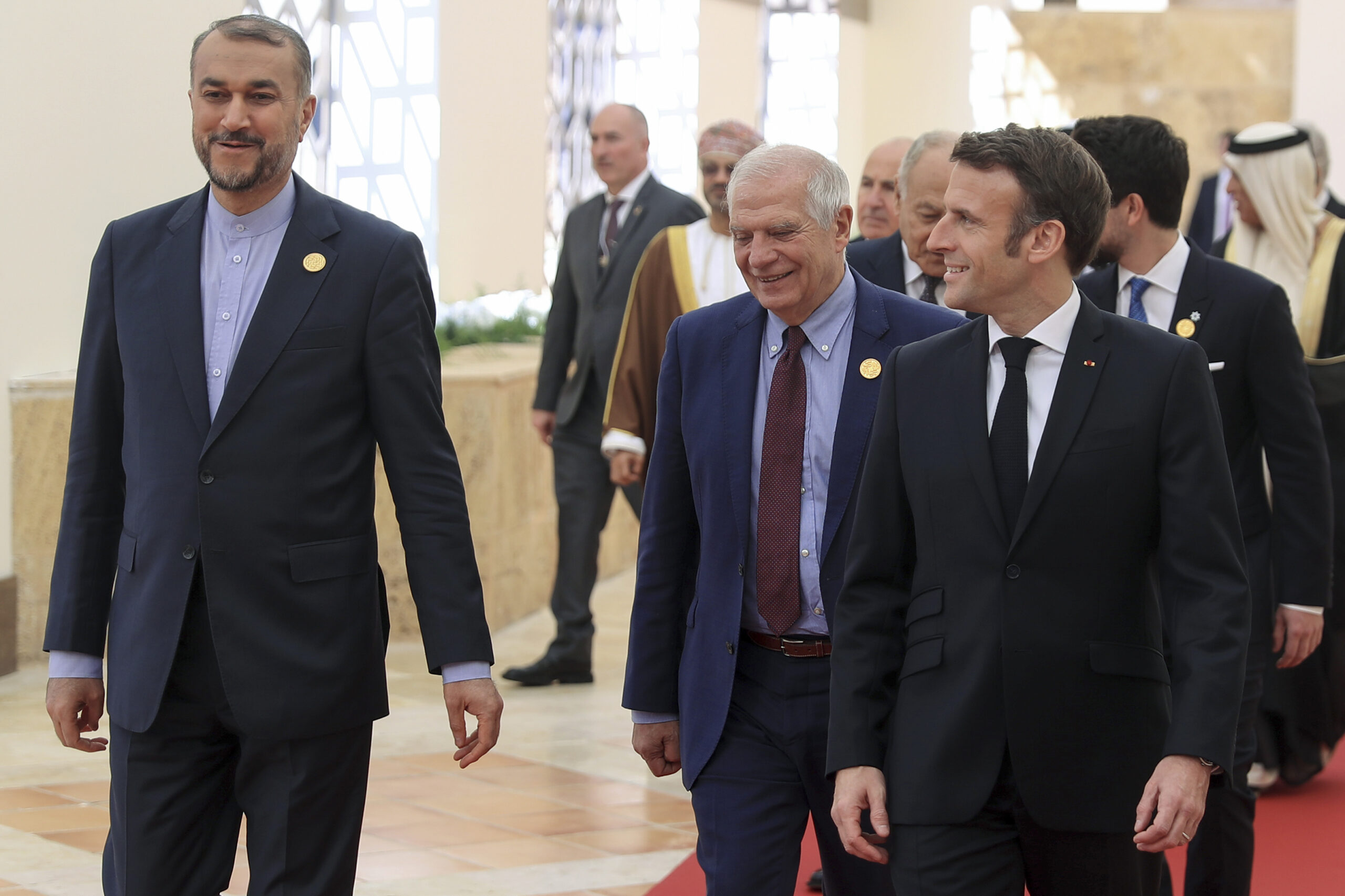 Iranian Foreign Minister Hossein Amir-Abdollahian, left, Josep Borrell, high representative of the Union for foreign affairs and security policy, center, and French President Emmanuel Macron walk during the second Baghdad Conference for Cooperation and Partnership, at the Dead Sea, Jordan, Dec. 20, 2022. (AP Photo/Raad Adayleh)