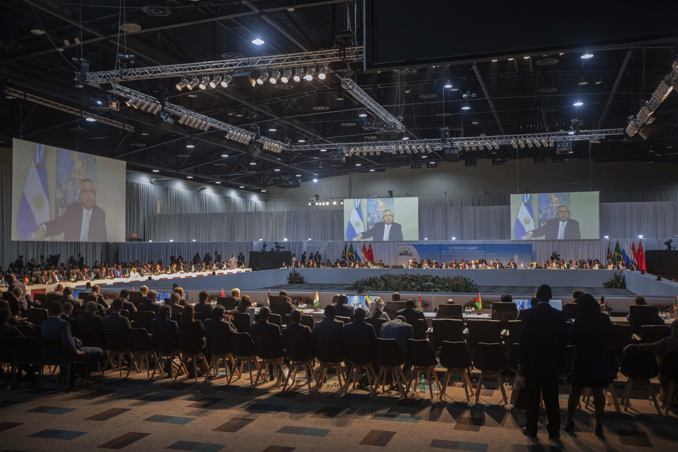 Argentine President Alberto Angel Fernandez appears on a screen as he addresses the 15th BRICS Summit, in Johannesburg, South Africa, August 24. (Kim Ludbrook/Pool via AP)