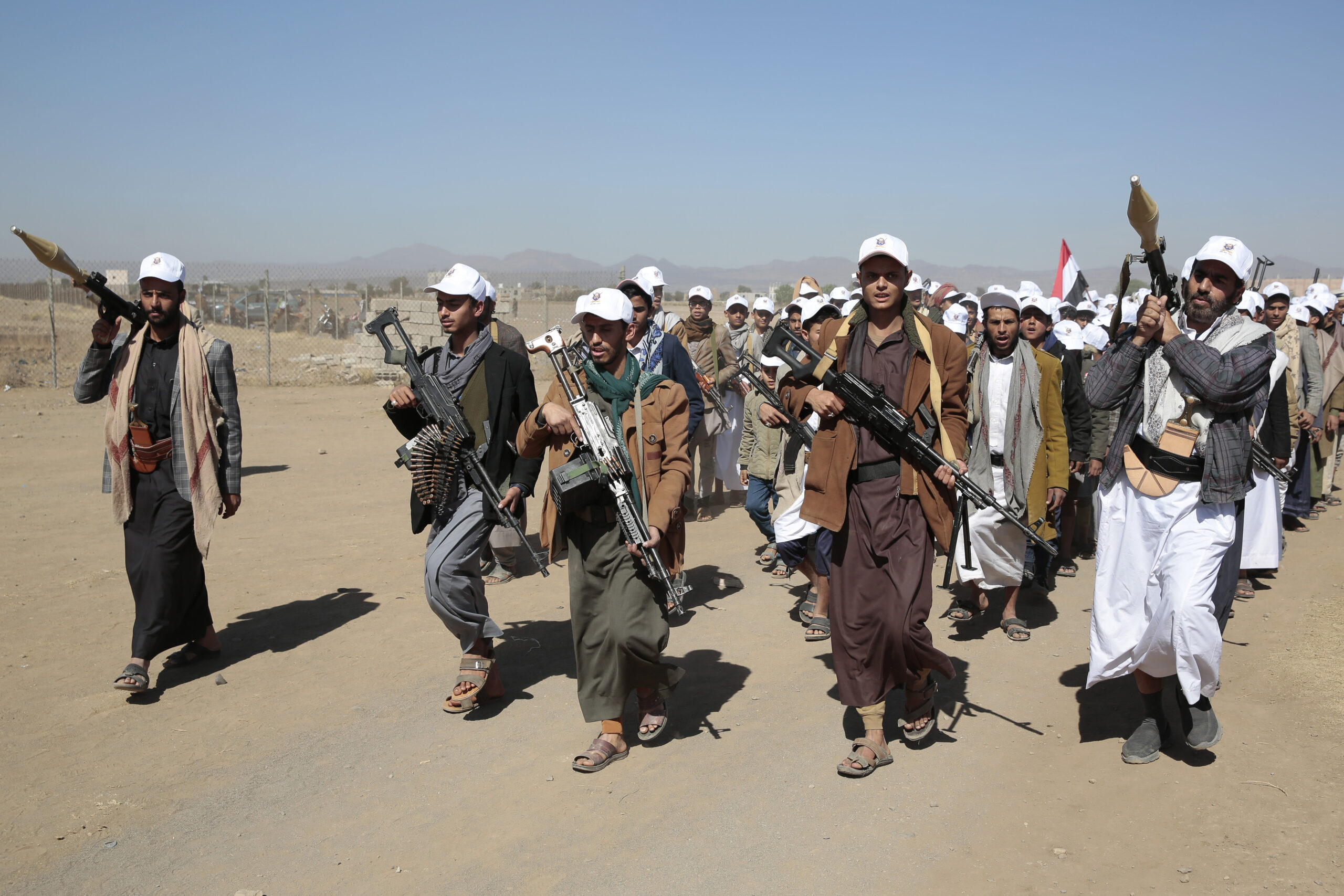 Houthi fighters stage a rally against the U.S. government designating the Houthis a terrorist group and against U.S.-led airstrikes, near Sanaa, Yemen, Jan. 25. (AP Photo /Osamah Abdulrahman )
