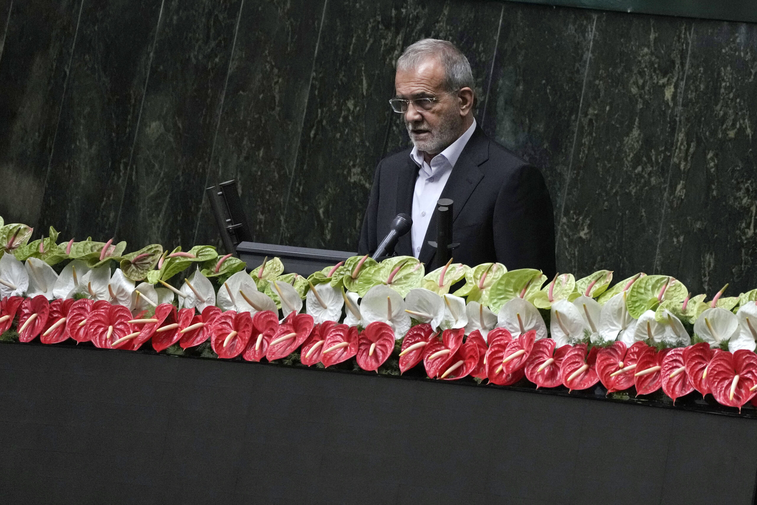 Newly-elected President Masoud Pezeshkian delivers a speech after taking his oath in a ceremony at the Parliament in Tehran, Iran, July 30. (AP Photo/Vahid Salemi)