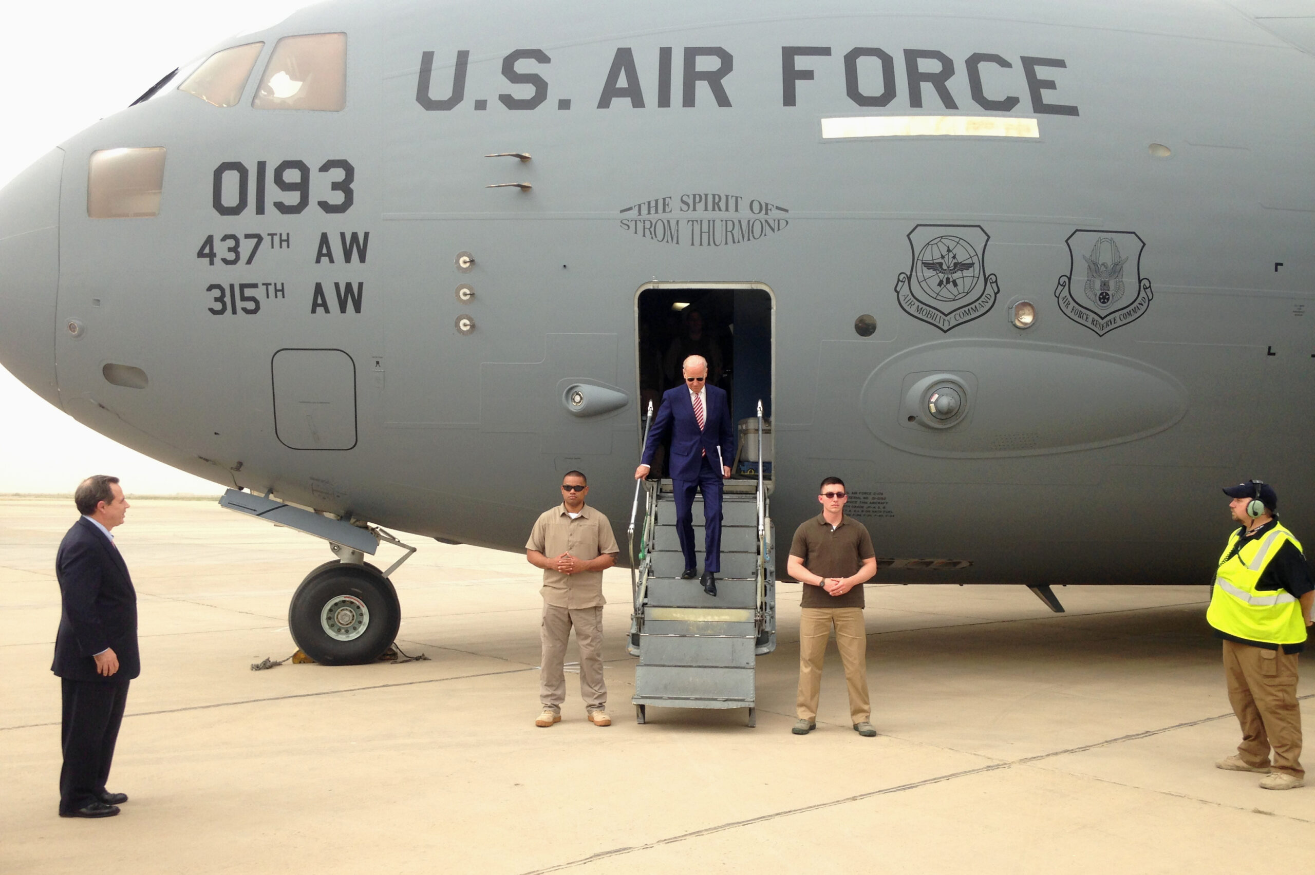 Then-U.S. Vice President Joseph R. Biden, Jr. steps off a C-17 military transport plane upon his arrival in Baghdad, Iraq, April 28, 2016. (AP Photo/Josh Lederman)