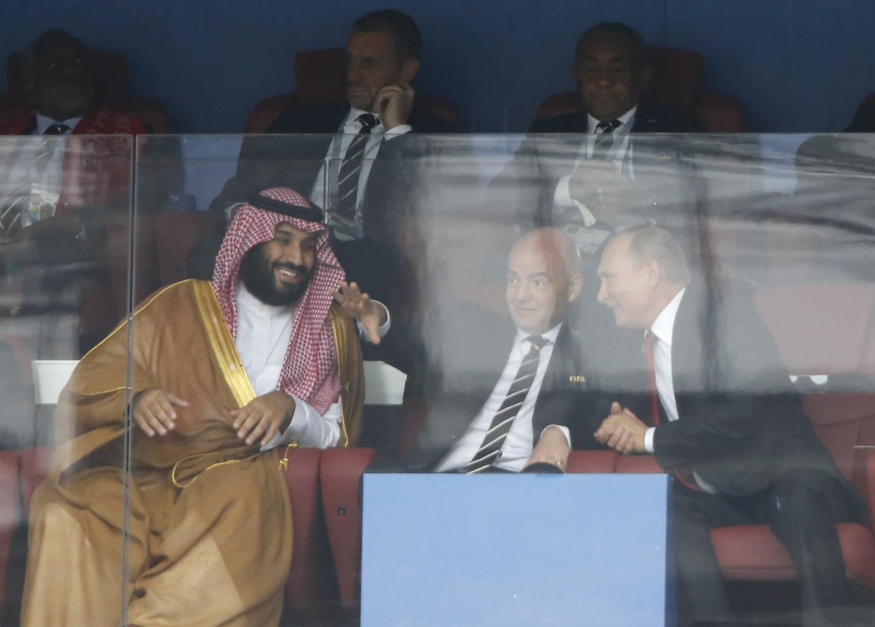 Saudi Arabia Crown Prince Mohammed bin Salman, left, FIFA President Gianni Infantino, center, and Russian President Vladimir Putin