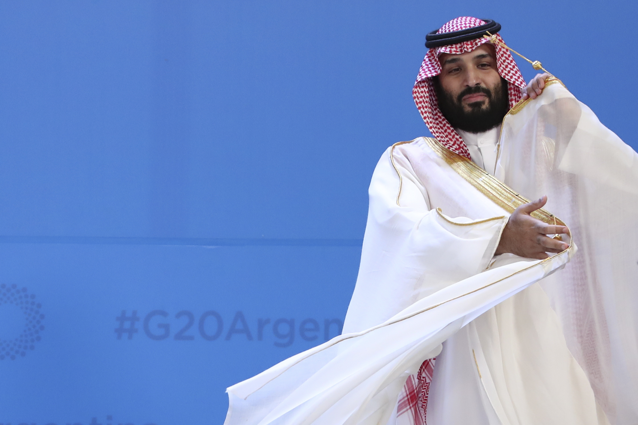 Saudi Arabia's Crown Prince Mohammed bin Salman adjusts his robe as leaders gather at the G20 Leaders Summit in Buenos Aires, Argentina, Nov. 30, 2018. (AP Photo/Ricardo Mazalan)