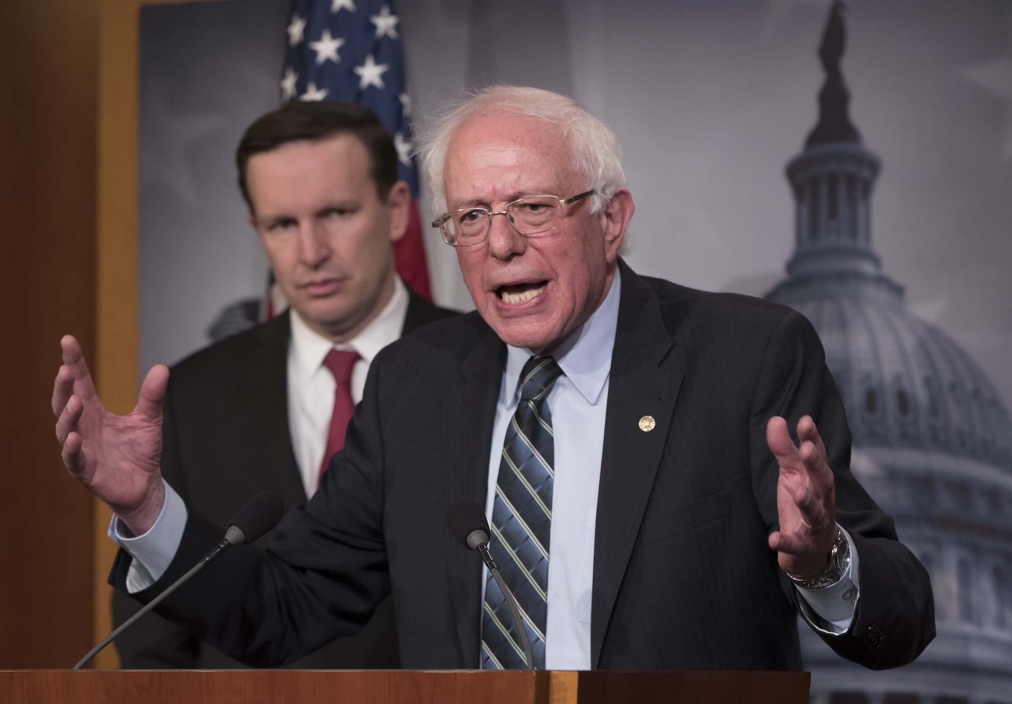 Senator Bernie Sanders, a Democrat from Vermont, joined at left by Senator Chris Murphy, a Democrat from Connecticut, holds a news conference after the Senate passed a resolution that would pull U.S. assistance from the Saudi-led coalition in Yemen, at the Capitol in Washington, DC, Dec. 13, 2018. (AP Photo/J. Scott Applewhite)