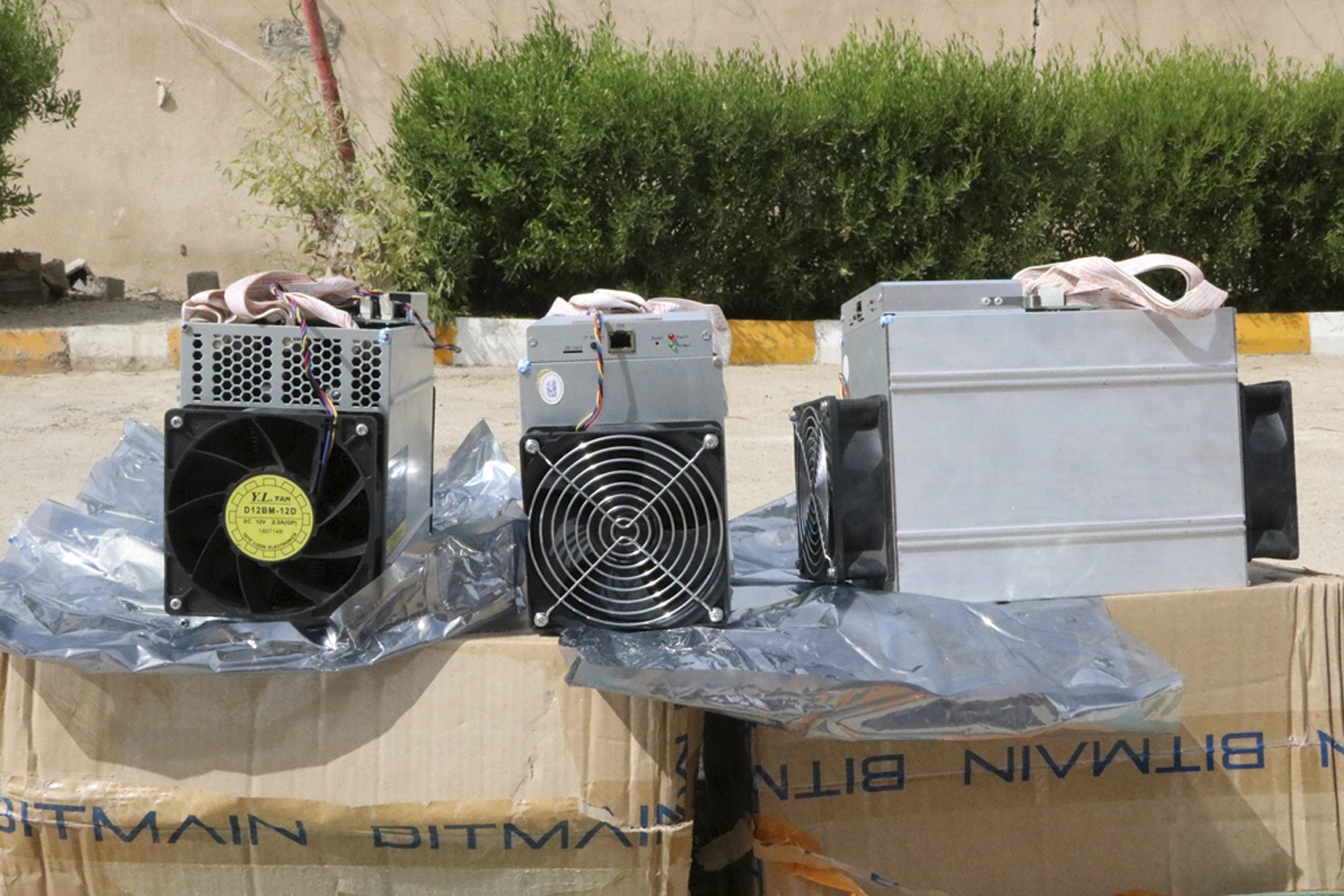 Boxes of machinery used in Bitcoin mining operations, confiscated by police in Nazarabad, Iran (News.police.ir via AP)