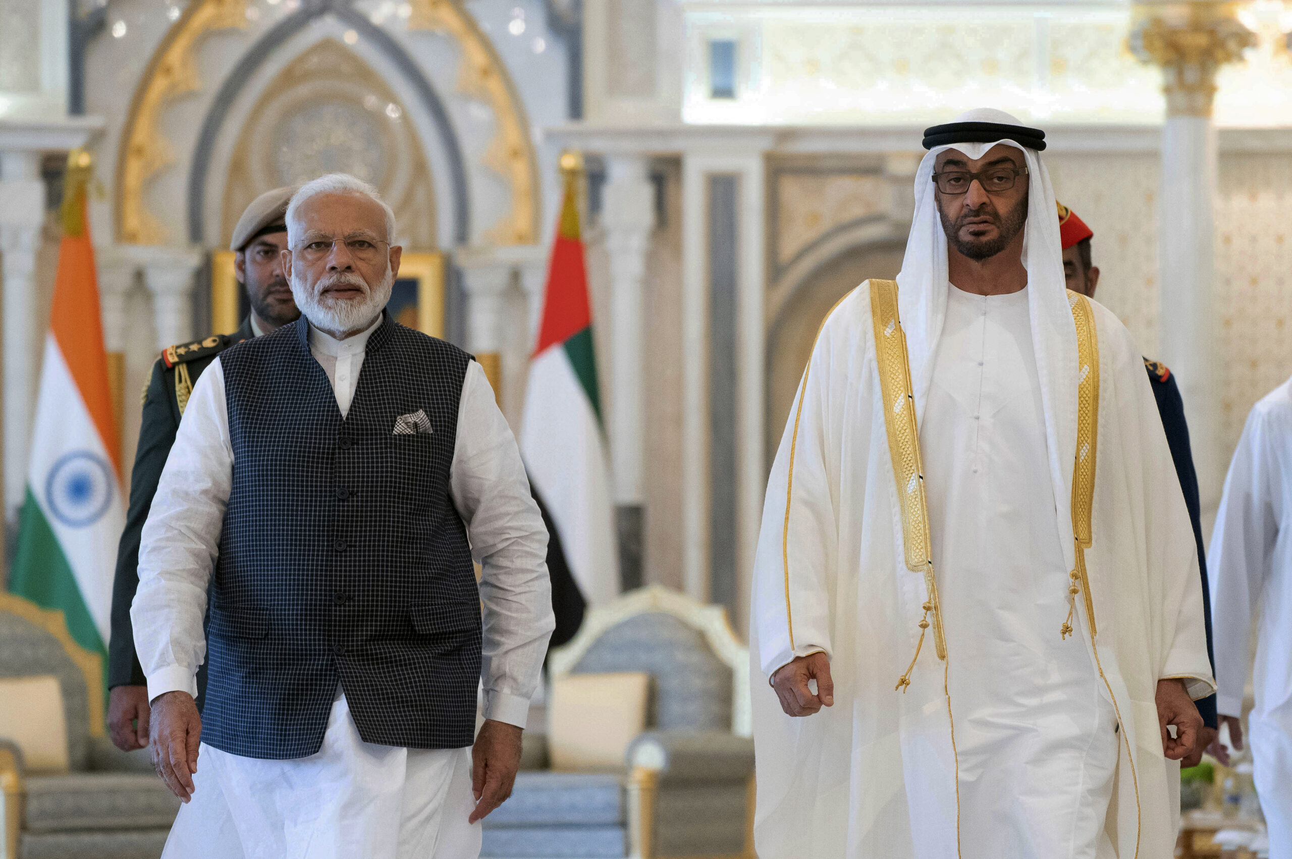 Indian Prime Minister Narendra Modi, left, walks with Abu Dhabi Crown Prince Mohammed bin Zayed al-Nahyan, right, in Abu Dhabi, United Arab Emirates, Aug. 24, 2019. (Ryan Carter - Ministry of Presidential Affairs/WAM via AP)