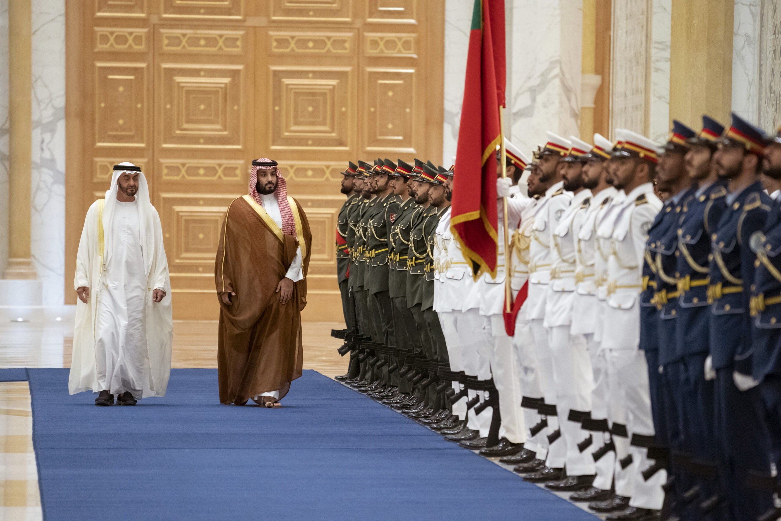 Saudi Crown Prince Mohammed bin Salman, right, inspects the honor guard next to Abu Dhabi Crown Prince Mohammed bin Zayed al-Nahyan in Abu Dhabi, United Arab Emirates, Nov. 27, 2019. (Rashed Al Mansoori/Ministry of Presidential Affairs via AP)