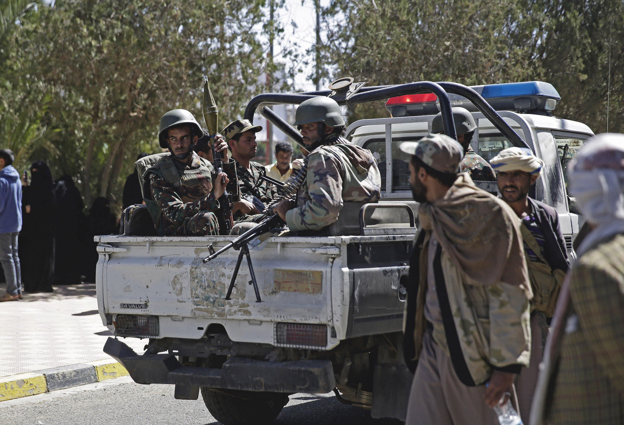 Yemeni soldiers secure Sanaa Airport ahead of the arrival of Houthi prisoners after being released by the Saudi-led coalition, Sanaa, Yemen, Nov. 28, 2019. (AP Photo/Hani Mohammed)