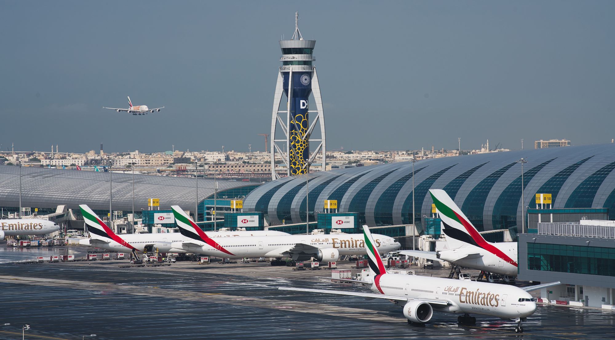 An Emirates jetliner comes in for landing at Dubai International Airport in Dubai, United Arab Emirates, Dec. 11, 2019. (AP Photo/Jon Gambrell)