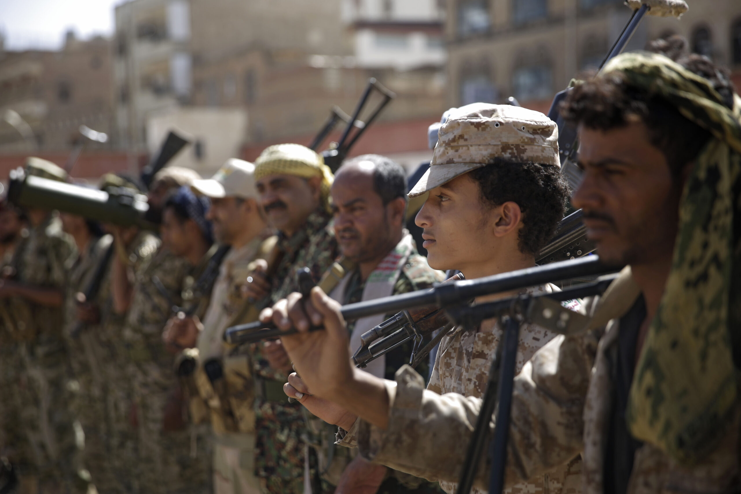Houthi rebel fighters display their weapons during a gathering aimed at mobilizing more fighters for the Houthi movement, Sanaa, Yemen, Feb. 20. (AP Photo/Hani Mohammed)