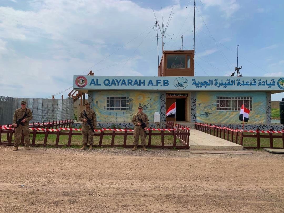 U.S. soldiers stand guard during the handover ceremony of Qayyarah Airfield to Iraqi Security Forces in Mosul, Iraq, March 27. (AP Photo/Ali Abdul Hassan)
