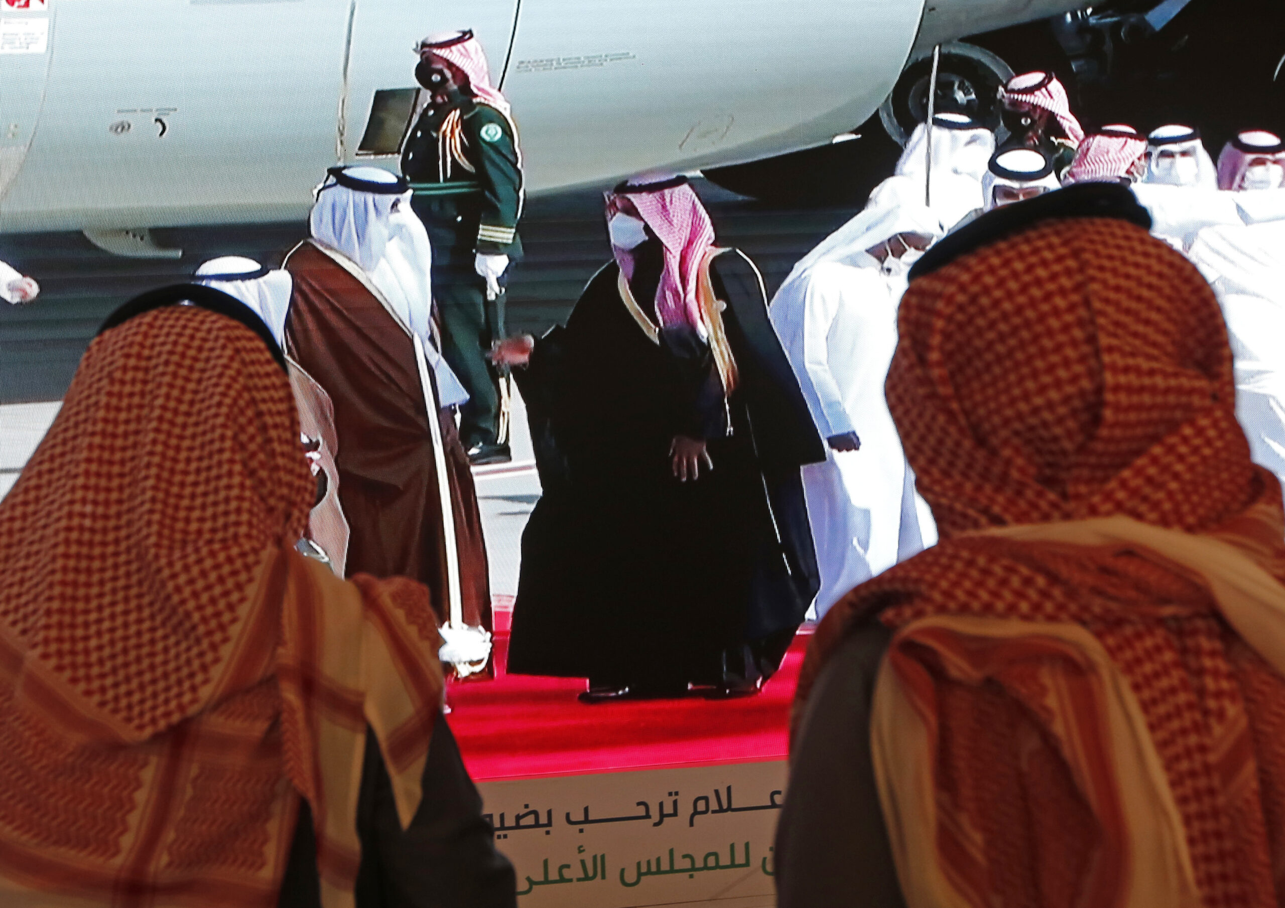 Saudi Crown Prince Mohammed bin Salman, center right, greets Qatari Emir Tamim bin Hamad al-Thani as he arrives at Al Ula airport in Saudi Arabia for the 41st Gulf Cooperation Council meeting, Jan. 5. (AP Photo/Amr Nabil)