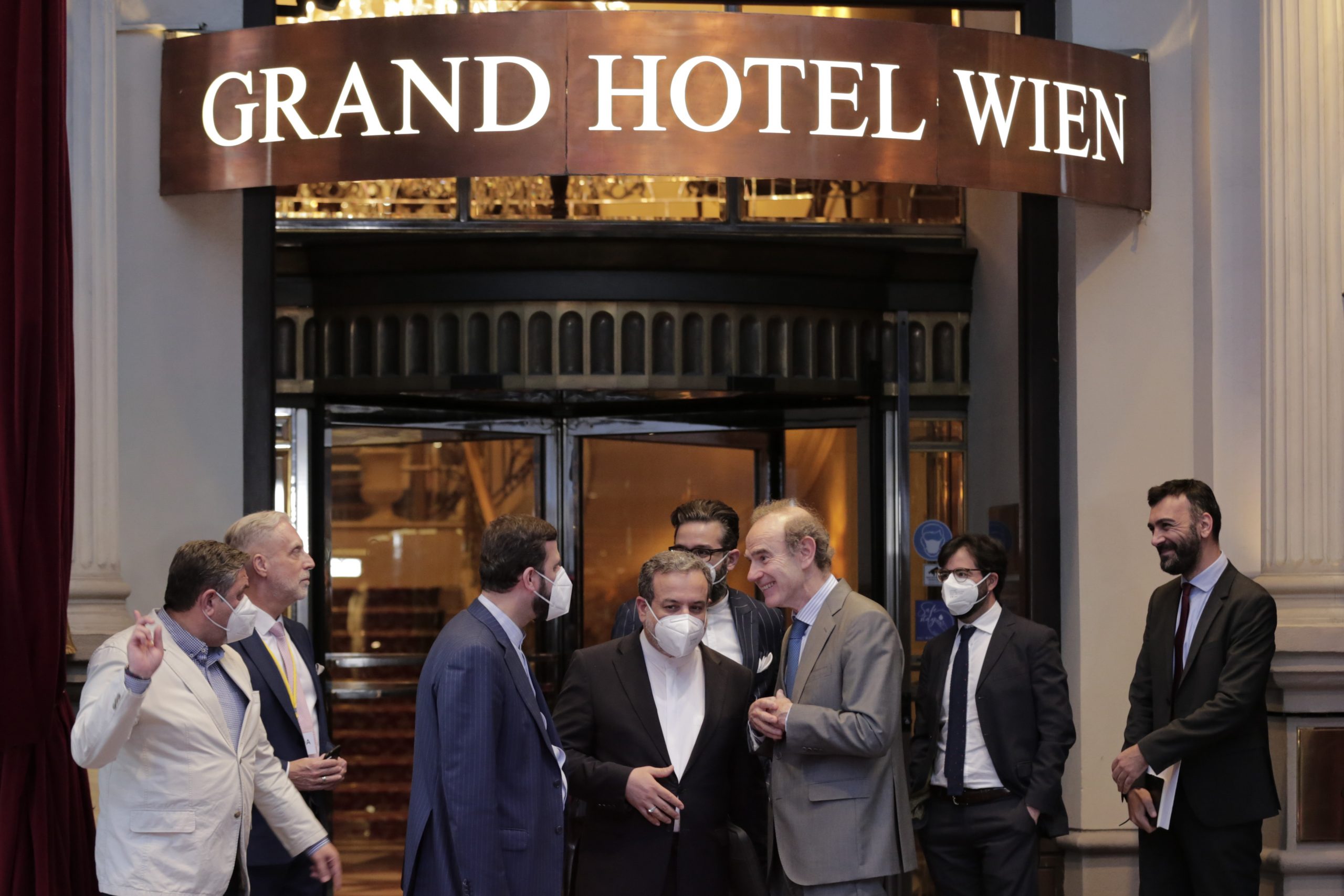 Kazem Gharib Abadi, Iran's governor to the International Atomic Energy Agency, Abbas Araghchi, political deputy at Iran's Ministry of Foreign Affairs of Iran, and Enrique Mora, deputy secretary general and political director of the European External Action Service, stand in front of the Grand Hotel Vienna where where closed-door nuclear talks are taking place, Vienna, Austria, June 2. (AP Photo/Lisa Leutner)
