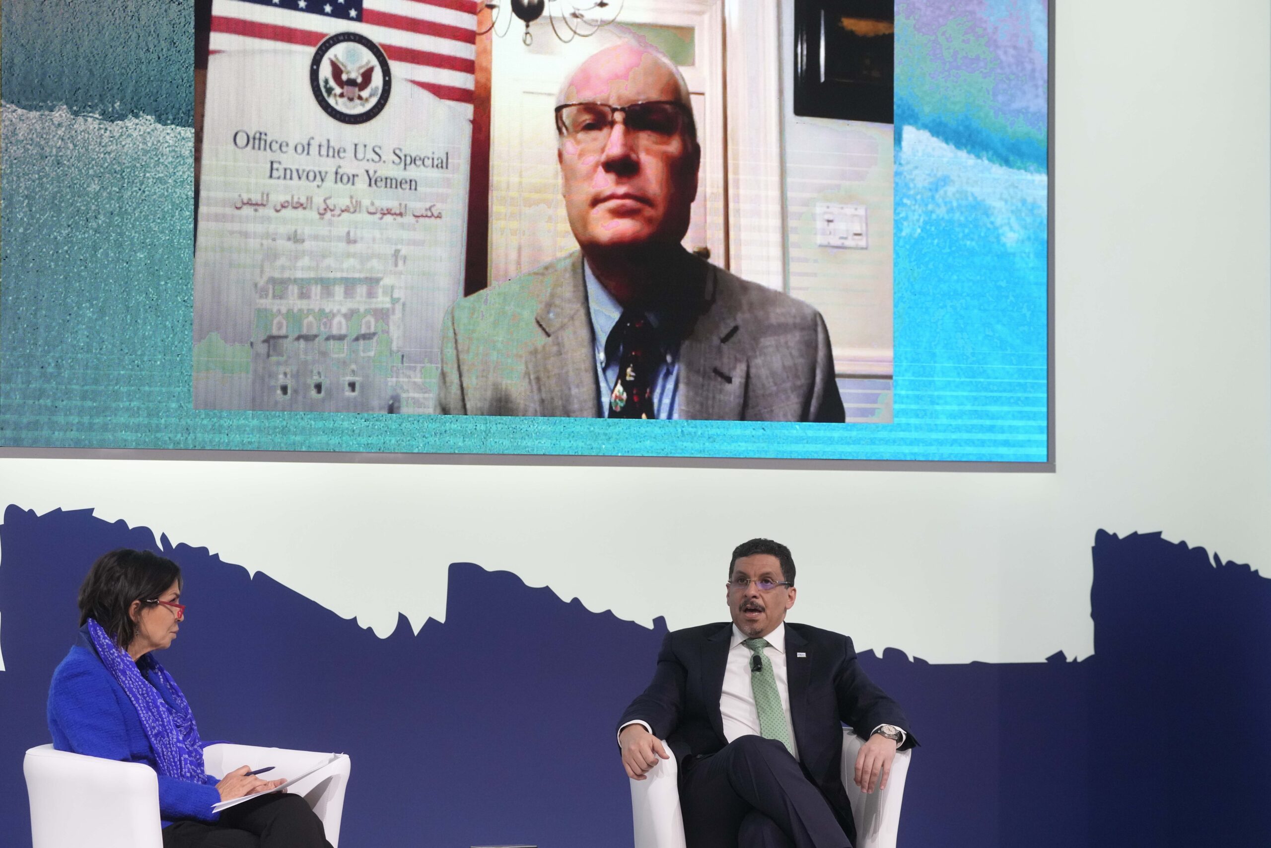 Ahmed Awad Bin Mubarak, Yemen's minister for foreign and expatriate affairs, bottom right, Tim Lenderking, U.S. special envoy for Yemen, top, and Italian journalist Maria Cuffaro participate in the panel 'The Future of Yemen' during the seventh MED Conference 2021 in Rome, Italy, Dec. 3. (AP Photo/Gregorio Borgia)