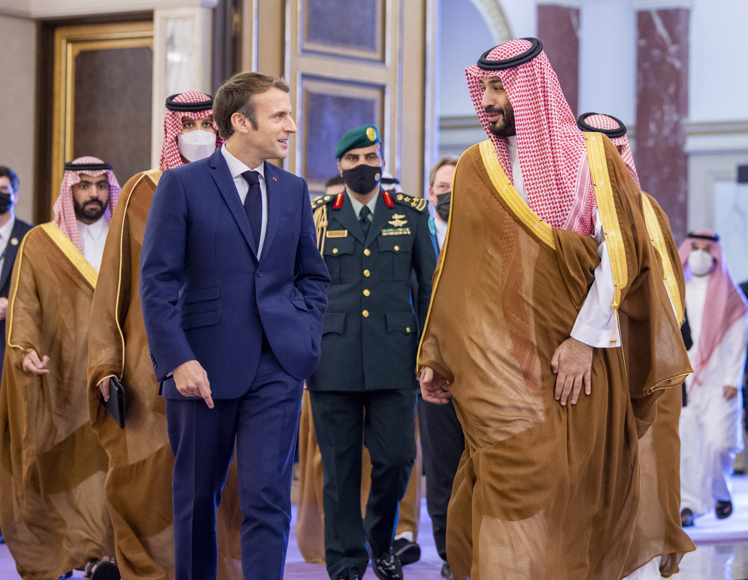 Saudi Crown Prince Mohammed bin Salman, right, greets French President Emmanuel Macron, left, upon his arrival in Jeddah, Saudi Arabia, Dec. 4. (Bandar Aljaloud/Saudi Royal Palace via AP)