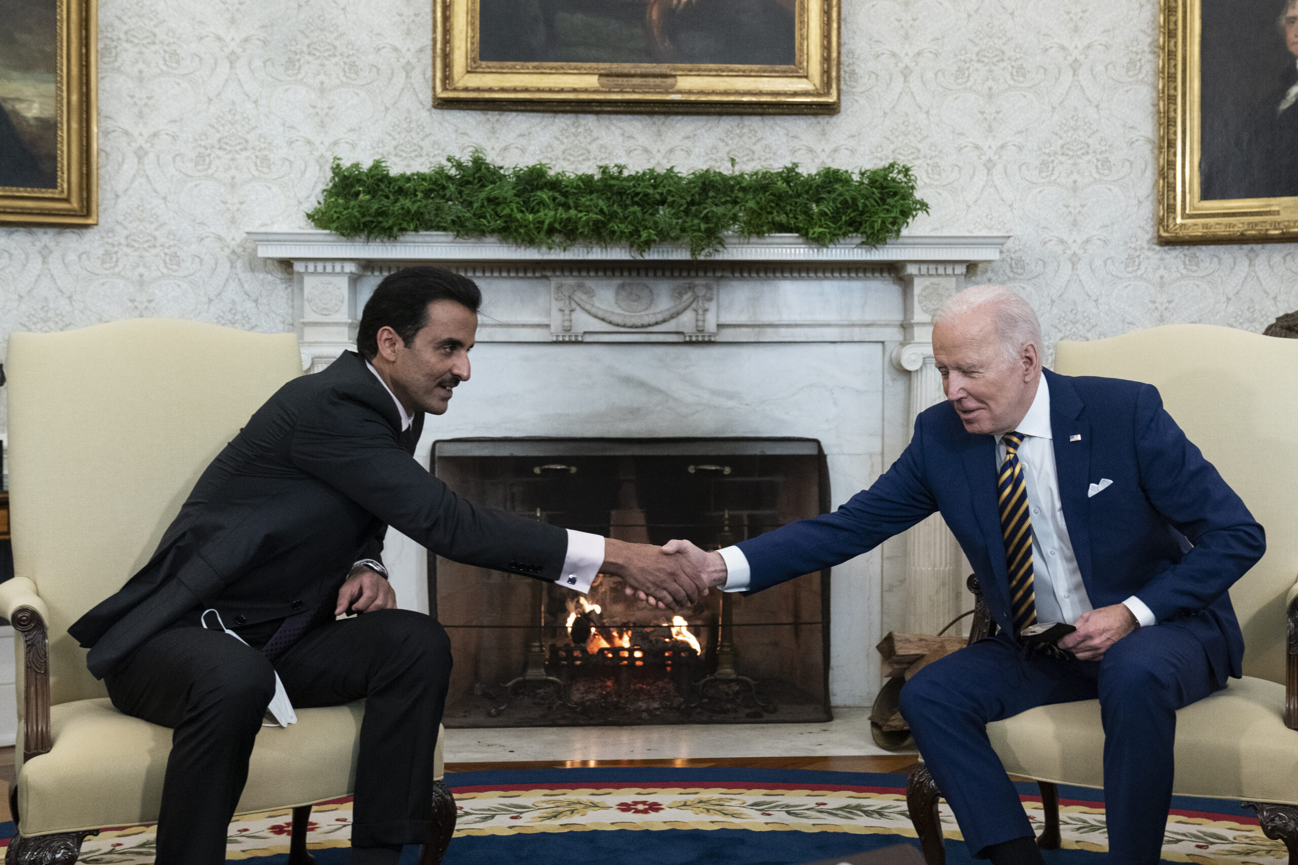 U.S. President Joseph R. Biden, Jr., right, shakes hands with the Qatari Emir Tamim bin Hamad al-Thani in the White House, Washington, DC, Jan 31. (AP Photo/Alex Brandon)