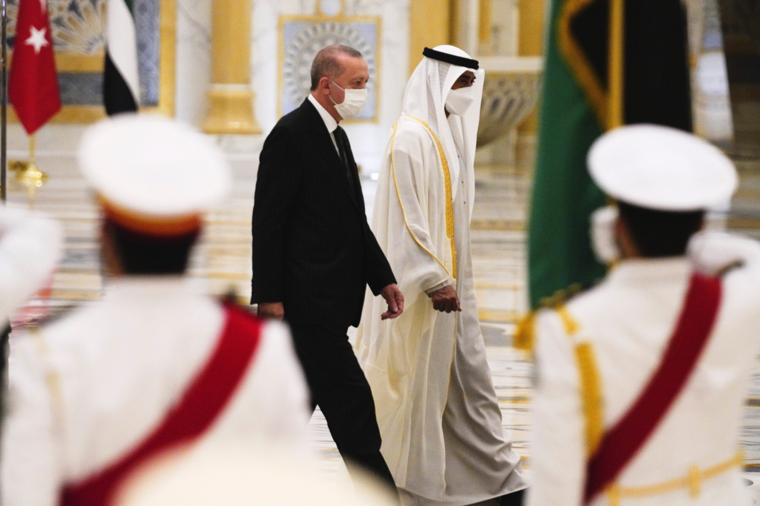 Turkish President Recep Tayyip Erdogan, left, and Abu Dhabi Crown Prince Mohammed bin Zayed al-Nahyan look over an honor guard at Qasr Al-Watan in Abu Dhabi, United Arab Emirates, Feb. 14. (AP Photo/Jon Gambrell)