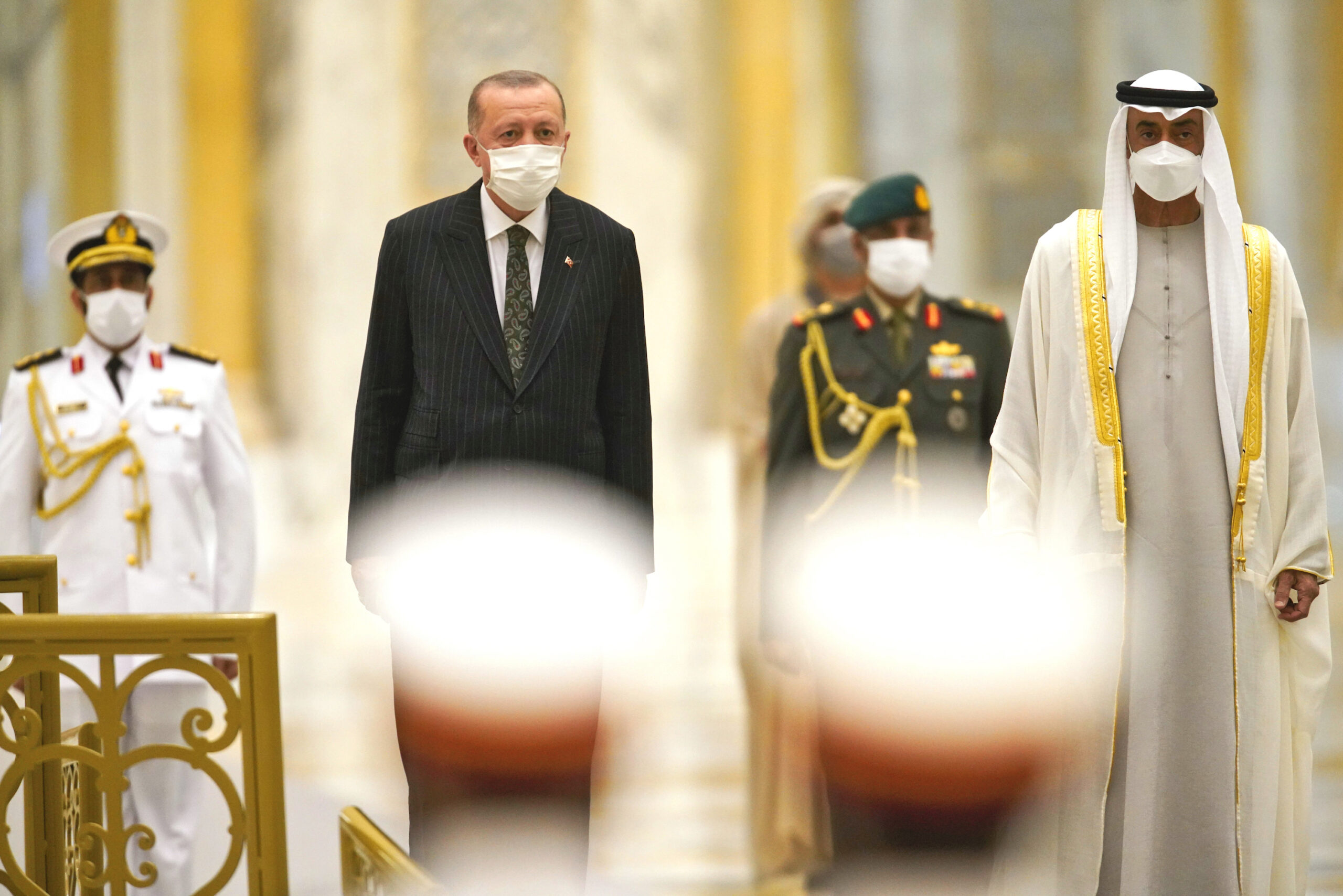 Turkish President Recep Tayyip Erdogan, left, and Abu Dhabi Crown Prince Mohammed bin Zayed al-Nahyan look over an honor guard, Abu Dhabi, United Arab Emirates, Feb. 14. (AP Photo/Jon Gambrell)