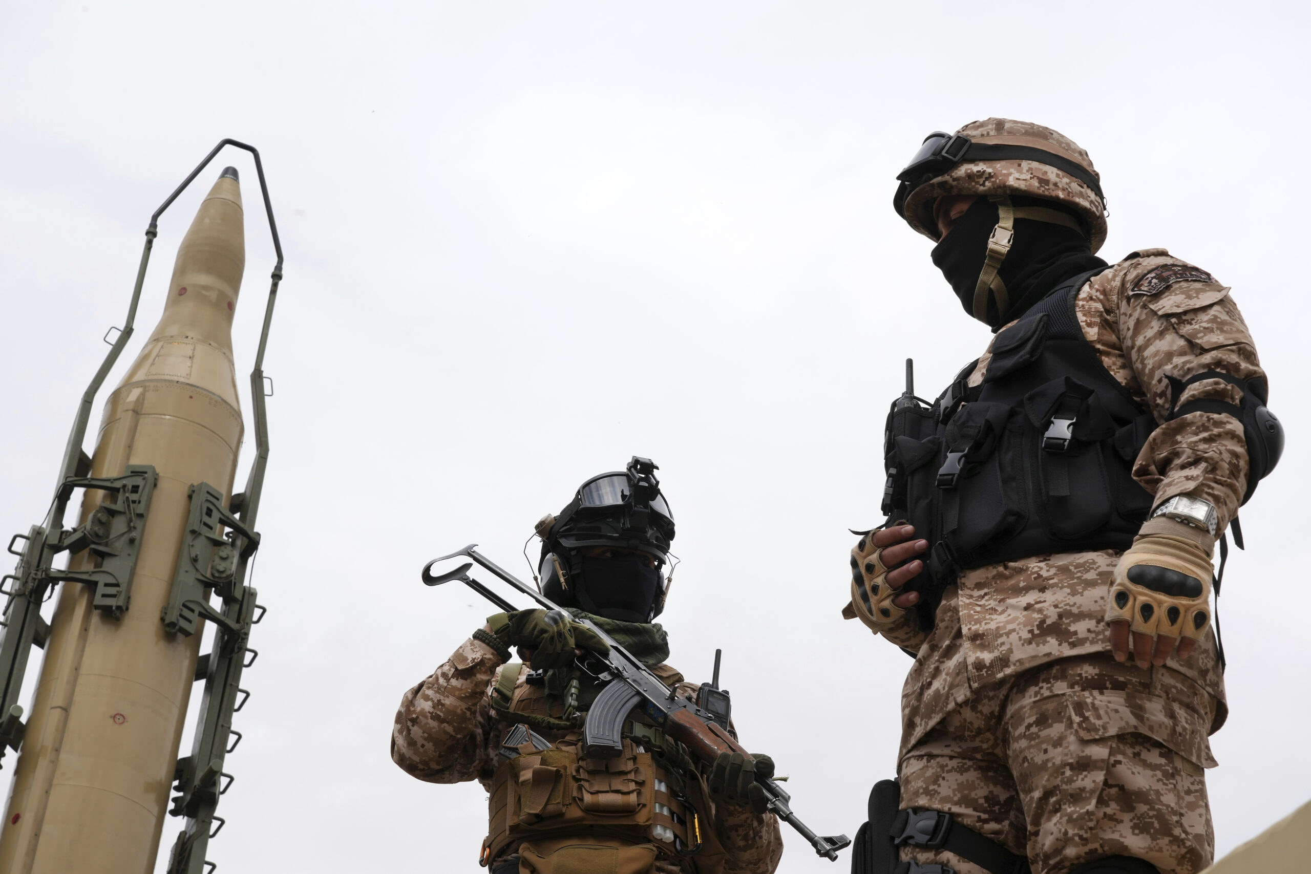 Iranian Revolutionary Guard members stand in front of a Shahab-3 missile displayed during the annual Jerusalem Day rally, Tehran, Iran, Friday, April 29. (AP Photo/Vahid Salemi)