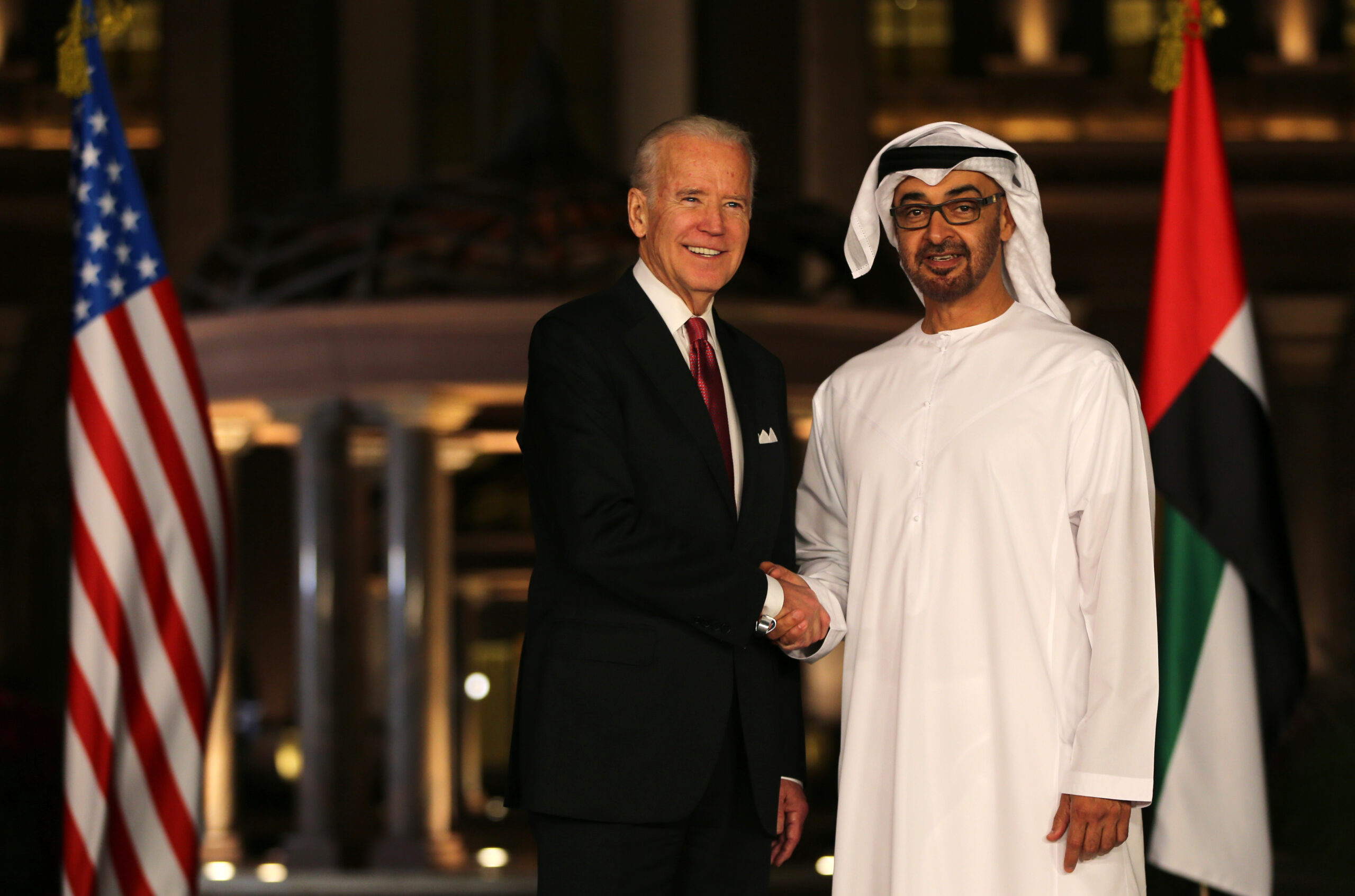 Joseph R. Biden Jr., then U.S. vice president, shakes hands with Abu Dhabi's crown prince, Mohammed bin Zayed al-Nahyan, in Abu Dhabi, United Arab Emirates, March 7, 2016. (AP Photo/Kamran Jebreili)